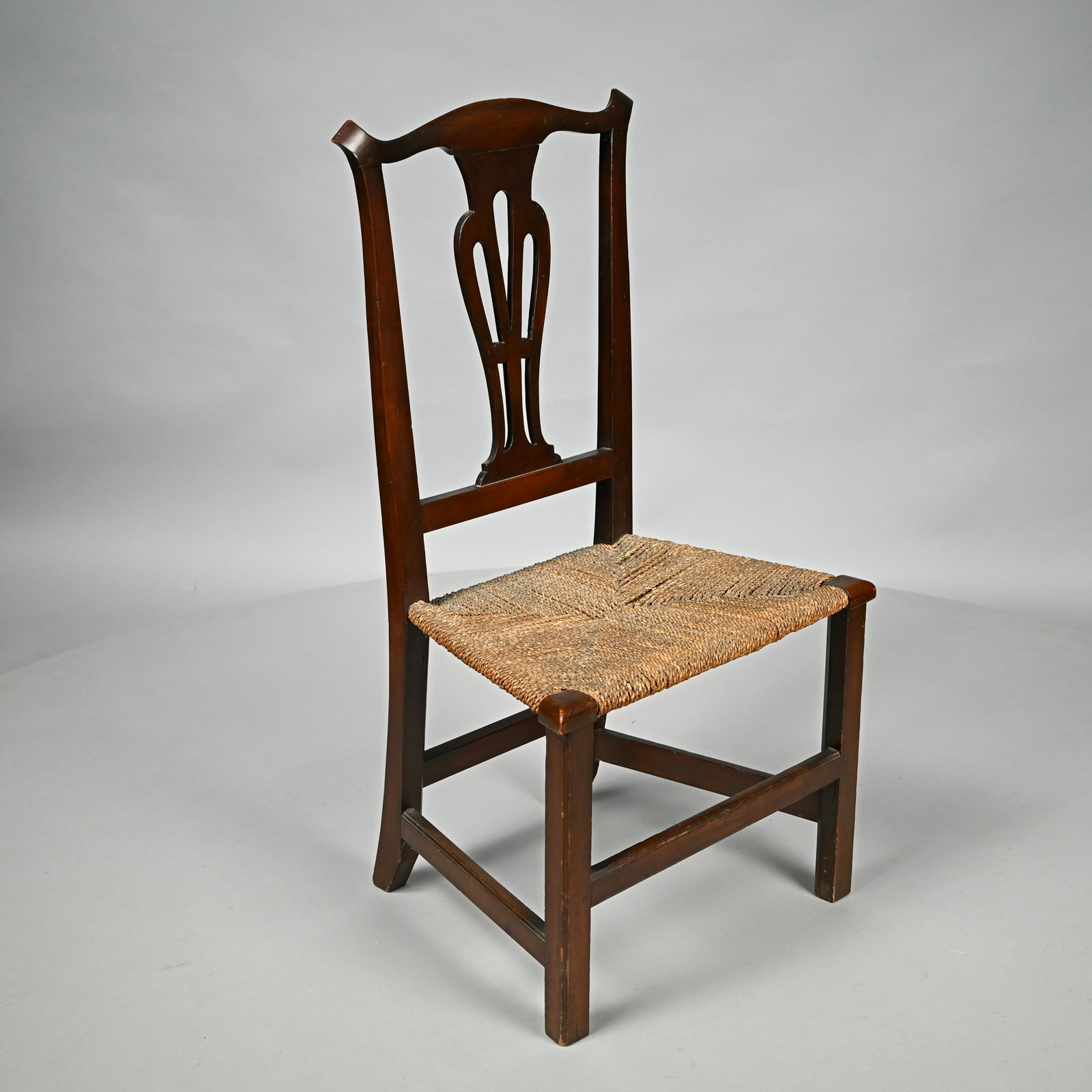 Josiah Bartlett's Chippendale Maple Dining Chair: Circa 1770. The serpentine crest rail above a pierced vase-form splat, the woven hemp seat raised on square molded legs joined by a box stretcher. H: 39.5 in., W: 21.5 in., D: 18.5 in.