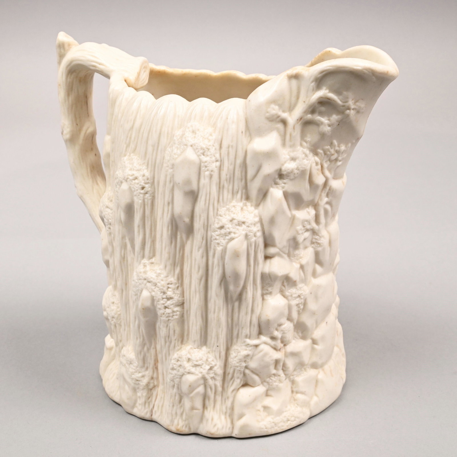 Bennington Parian 'Niagara Falls' Pitcher, USPC: American Parian 'Niagara Falls' Pitcher, United States Pottery Co., Bennington, Vermont, 1852-58. Molded with cliffs and under the spout with a waterfall cascading past craggy rocks and climbing plant
