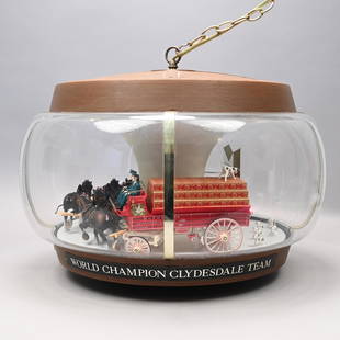 Budweiser Clydesdale Carousel Motion Hanging Sign: Budweiser Clydesdale Carousel Motion Sign and Hanging Light, Twentieth Century. Enclosing the "BUDWEISER KING OF BEERS" logo and a model of the "WORLD CHAMPION CLYDESDALE TEAM," with two draymen drivi