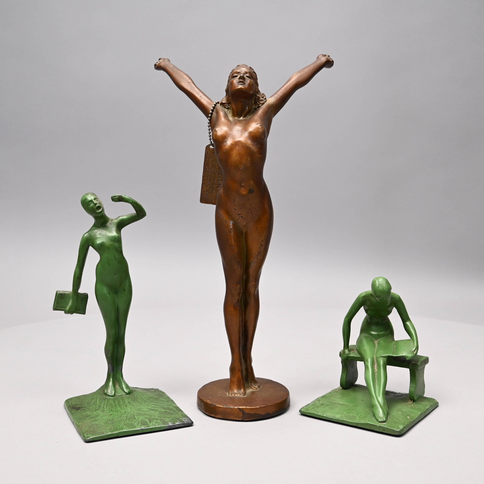 McClelland Barclay Bronze & Two R.G. Thew Figures: McClelland Barclay (American, 1891-1943). Nude Woman Stretching, Patinated Bronze Figure, Circa 1930. Accompanied by a bronze tag inscribed "McClelland Barclay CREATOR OF THE FISHER BODY GIRL AND CELE