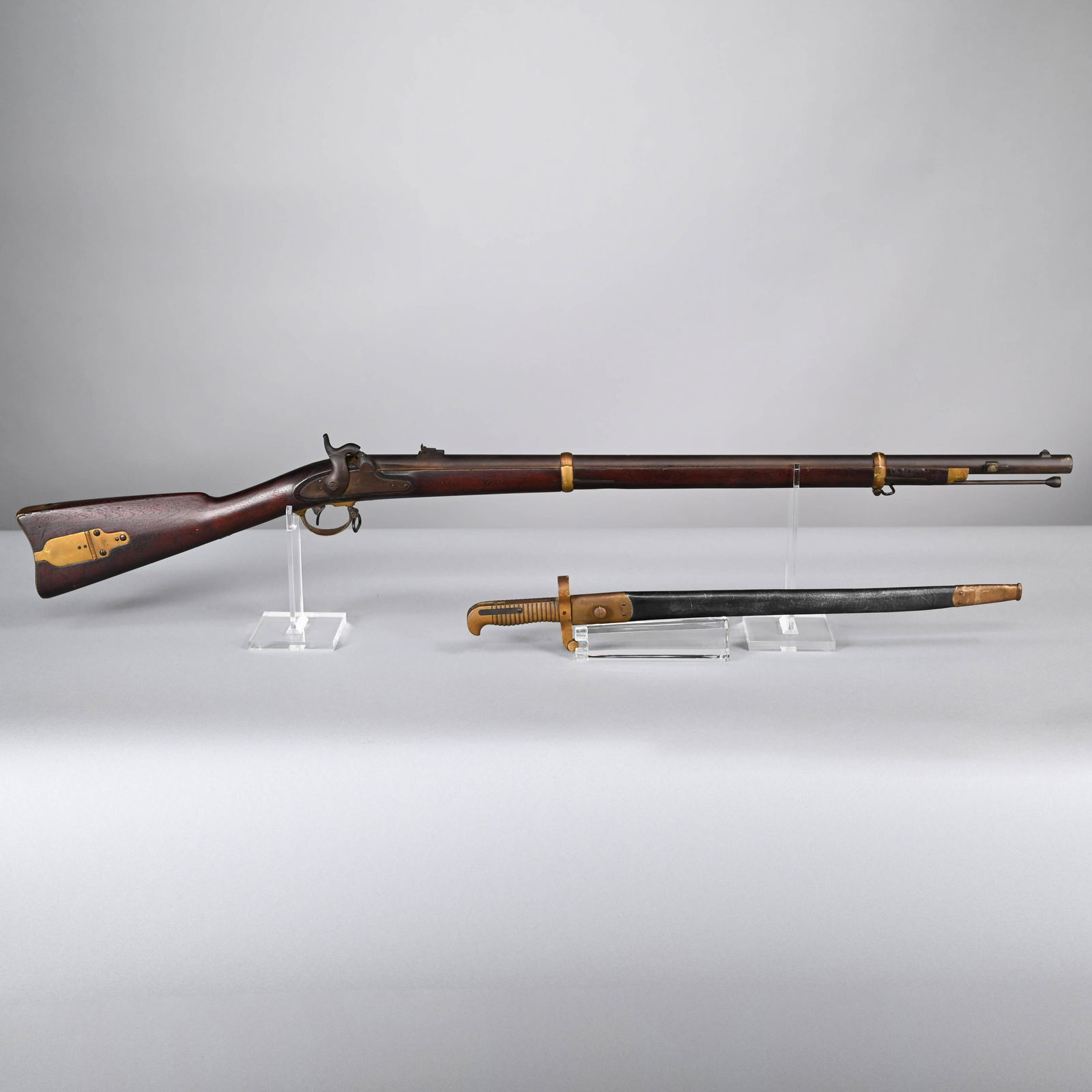 Remington 1863 Zouave Contract Rifle & Bayonet: Remington 1863 Zouave Contract Rifle & Bayonet with Scabbard. .58 Caliber. The lock plate marked "REMINGTON'S/ ILON, N.Y." with displayed American eagle and "1863," the 33-inch barrel with pivoting tw