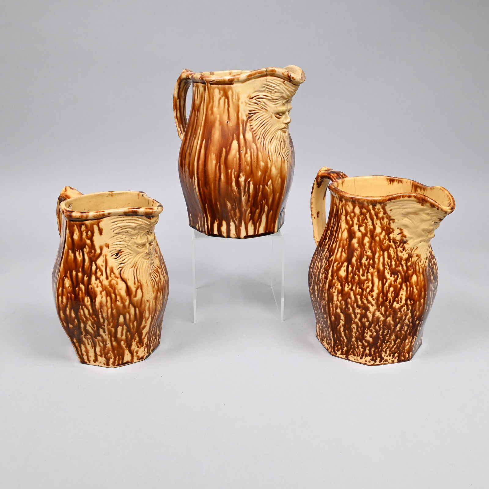 Three Rockingham-Glazed Yellow Ware Mask Pitchers (1 of 14)