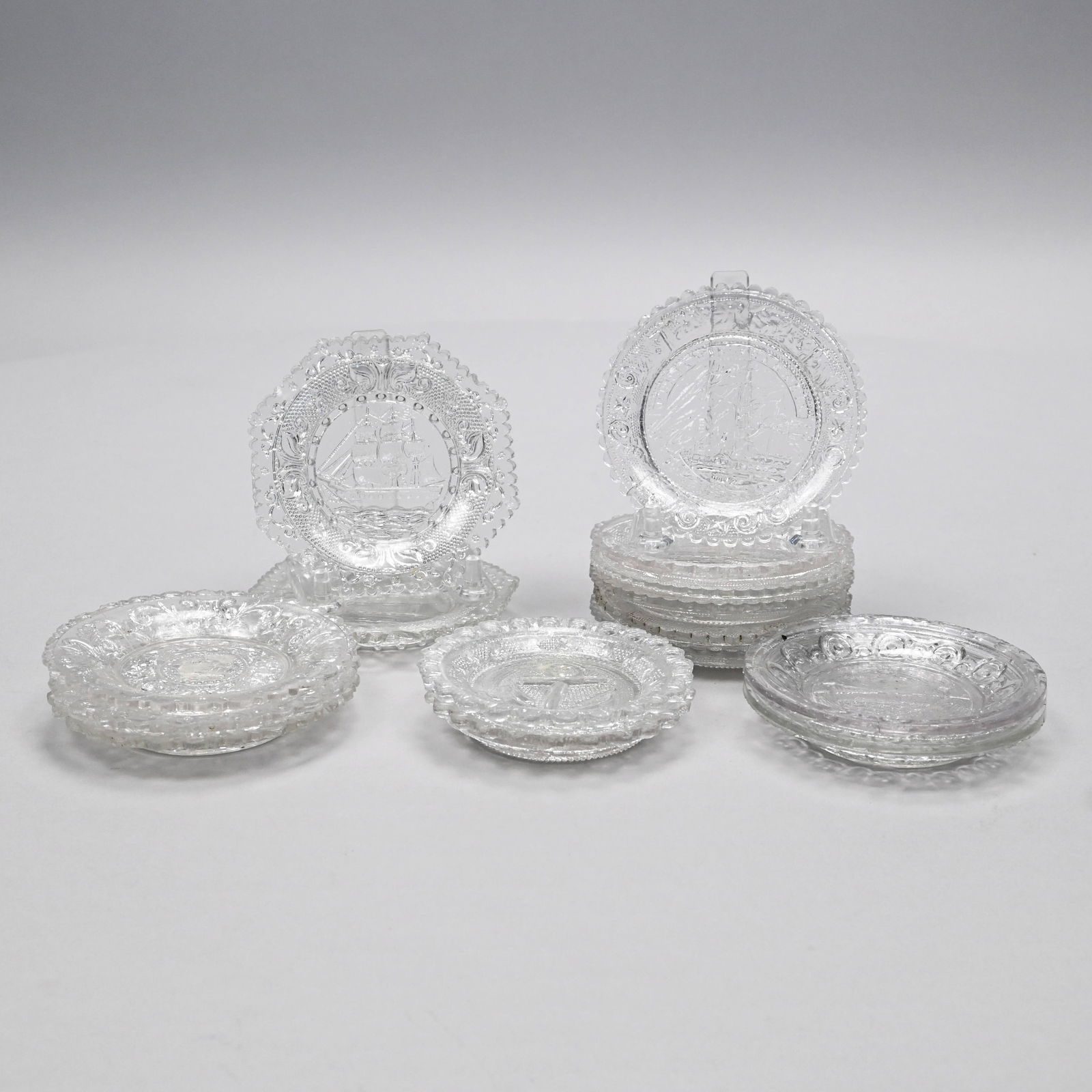Group of Pressed Colorless Glass Cup Plates (1 of 14)