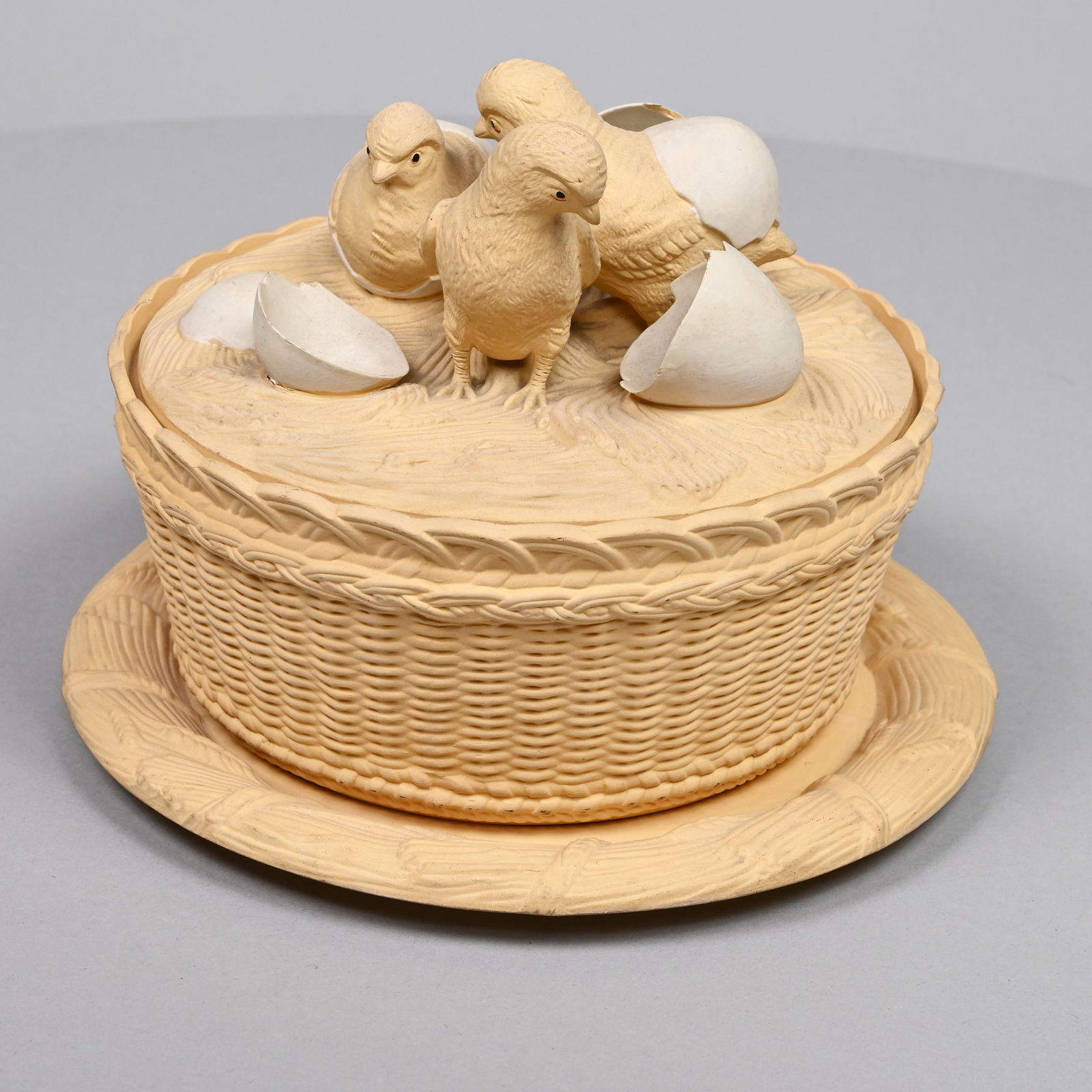 Bohemian Biscuit Porcelain Dish, W. Schiller & Son: Wilhelm Schiller & Son, Obergrund, 1885-1914. The dish modelled as a basket, the cover with a group of chicks hatching on a bed of wheat, the stand within a molded wheat border, the dish impressed "W.
