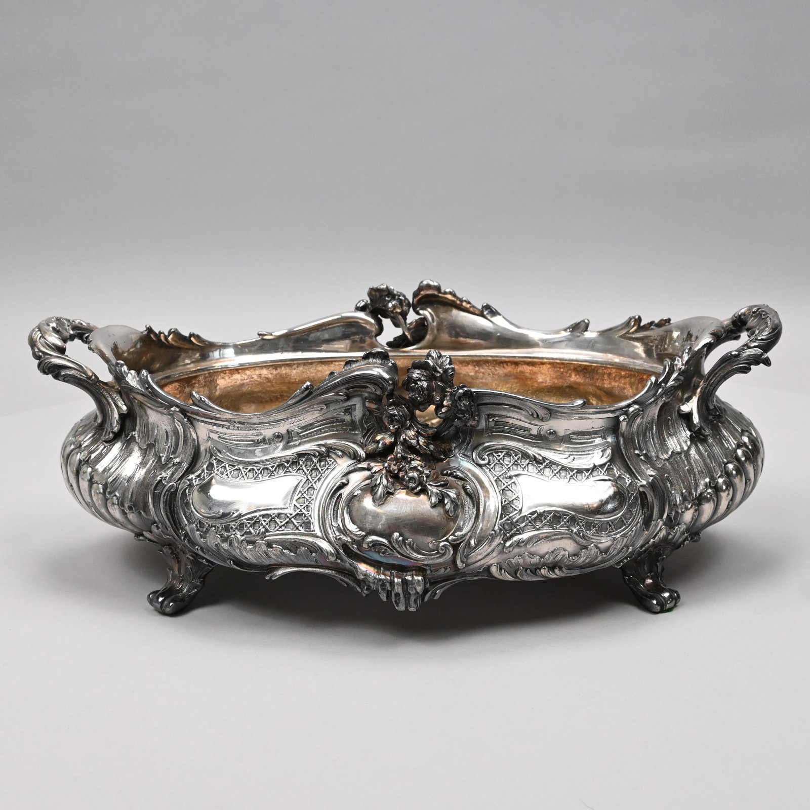 Louis XV Style Silverplate Centerpiece/ Jardiniere: Louis XV Style Silverplate Centerpiece or Jardiniere, Late Nineteenth-Early Twentieth Century. Of bombe form, cast on each long side with a floral spray and cartouche, within trellis diaperwork panels