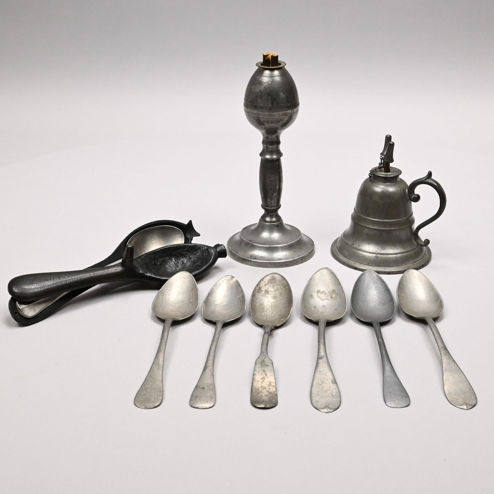Two Massachusetts Pewter Lamps,Spoon Mold & Spoons: Two Massachusetts Pewter Whale Oil Lamps, and a Cast-Iron Spoon Mold with Seven Pewter Spoons, Nineteenth Century. The first lamp Morey & Ober, Boston, 1852-55, of bell form with two burners, touchmar