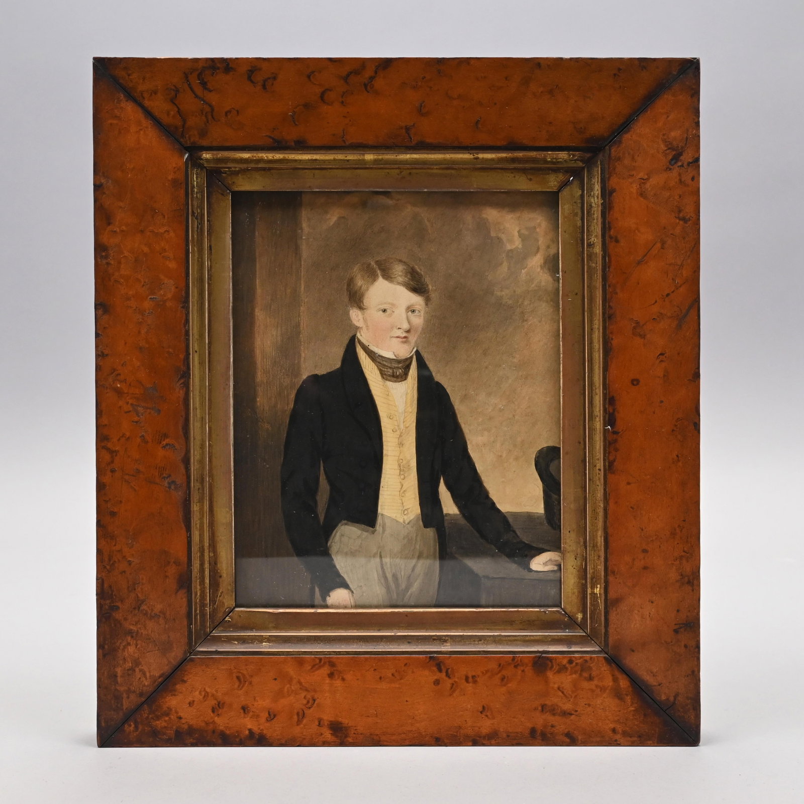American or English School - Portrait of a Youth: American or English School. Portrait of a Youth. Watercolor and ink on paper. Depicted three-quarter length, standing with one hand resting on a table beside a top hat, wearing a scarf, waistcoat, tai