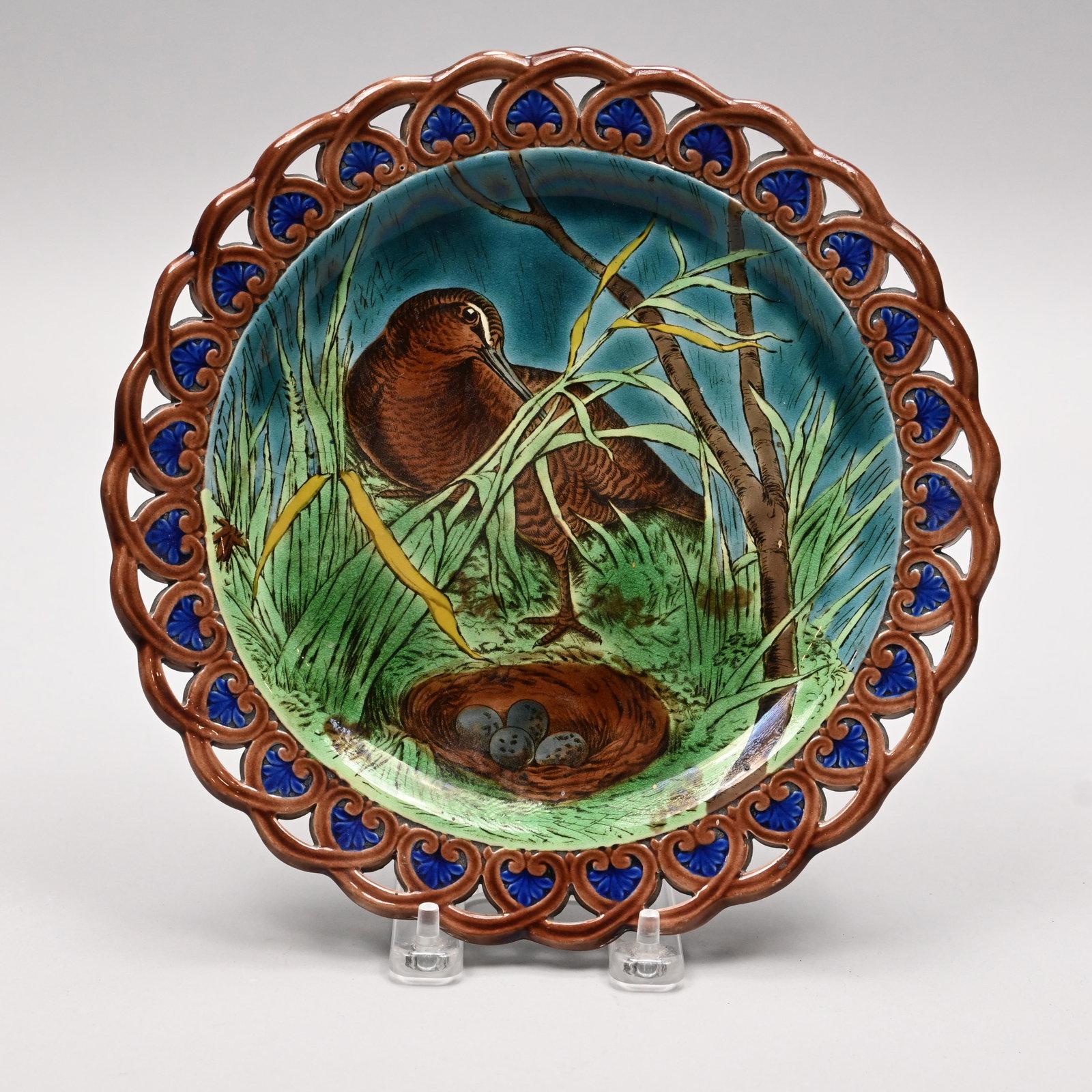Wedgwood Majolica 'Game' Series Plate, Henry Hope: Wedgwood Majolica 'Game' Series Plate, Designed by Henry Hope Crealock (British, 1831-91), 1875. Transfer-printed with a view of a woodcock hiding in grasses behind a nest of eggs, the rim glazed in b