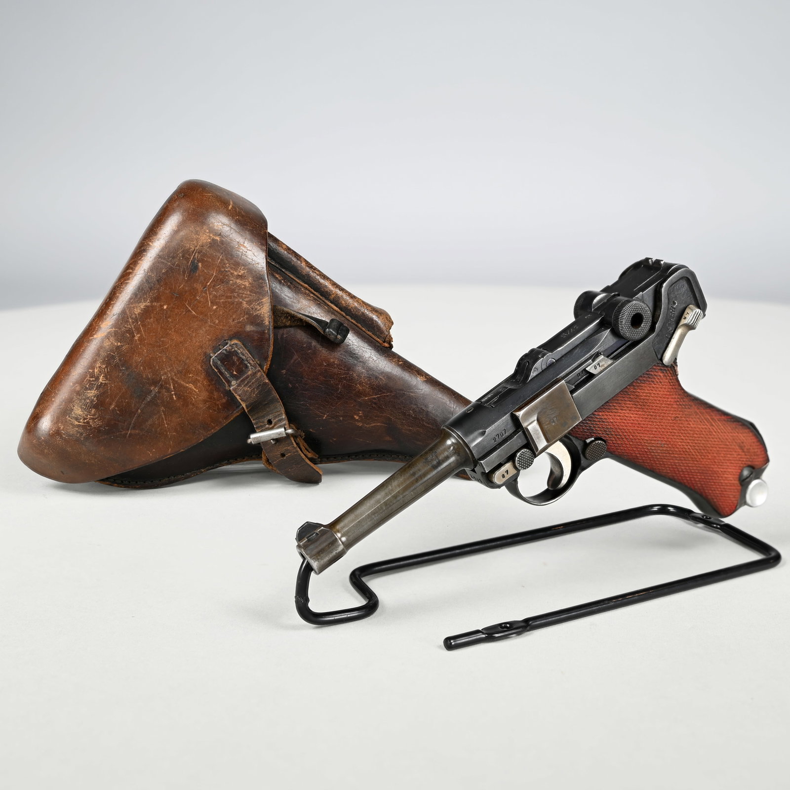 German Mauser S/42 Code "G" Date P.08 and Holster: German Mauser S/42 Code "G" Date (1935) P.08 Luger Semi-Automatic Pistol with Holster, Cal. 9mm. Serial #2707, produced under the German code S/42 by Mauser, the barrel extension dated "G" for 1935, a