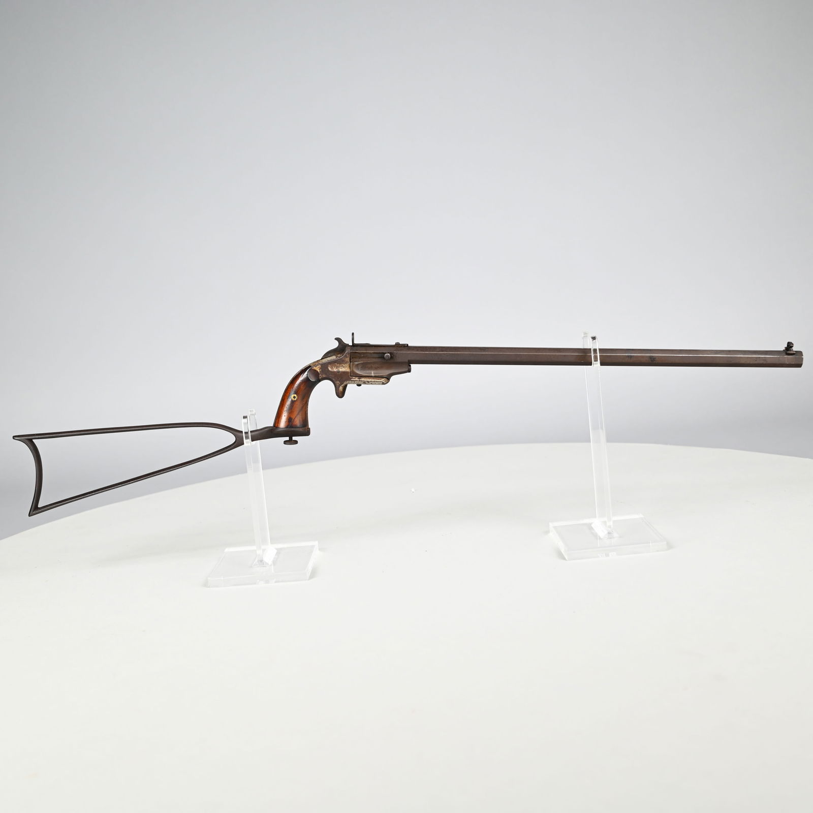 Frank Wesson Model 1870 Single Shot Pocket Rifle: Frank Wesson Model 1870 Single Shot Pocket Rifle, Cal. .32. Center Fire. Serial #40, the 18-inch octagonal barrel with pivoting bead/peep front sight and peep/notched rear, faint markings on side of r