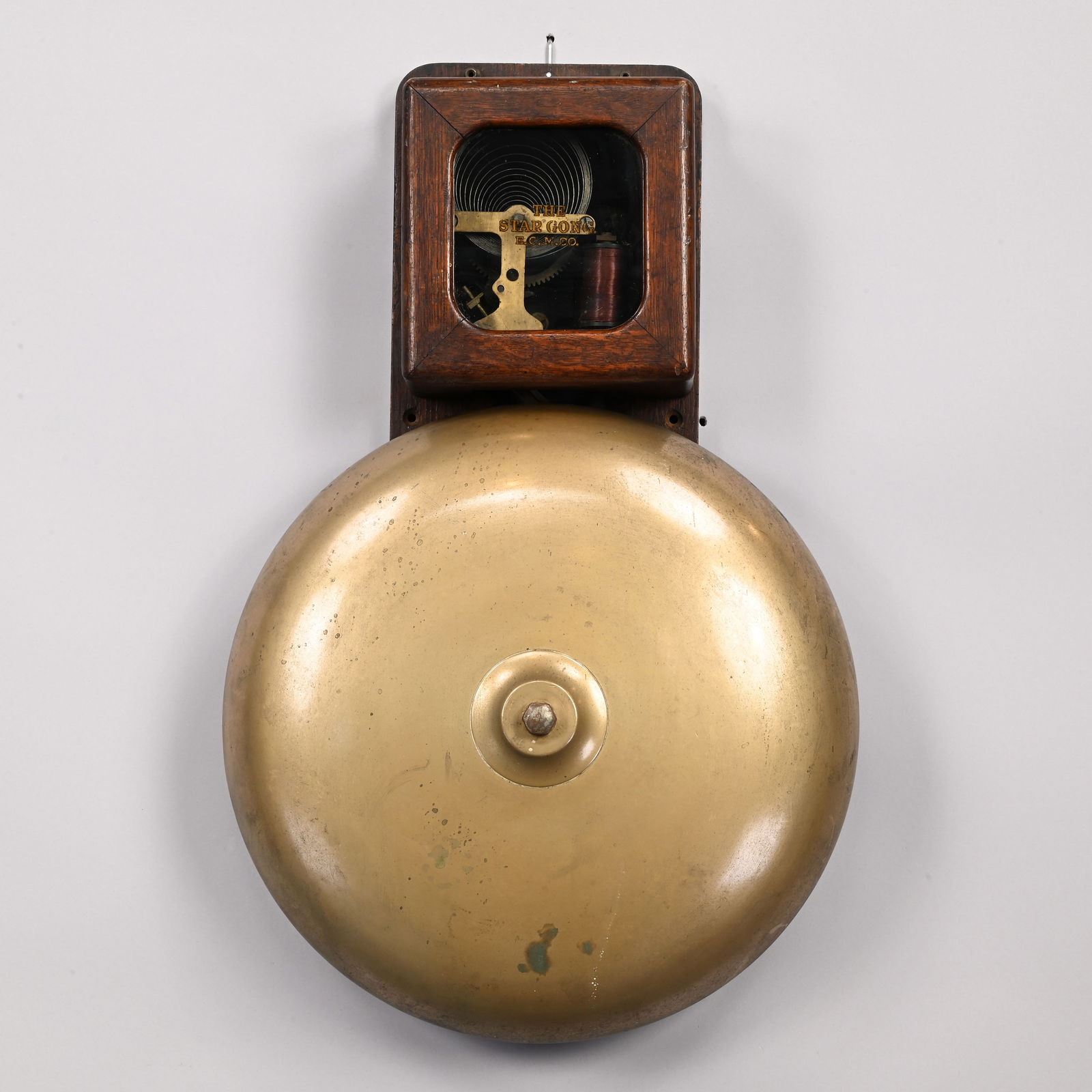 The Star Gong Oak Fire Alarm Station Bell, E.C.M.: "The Star Gong" Oak and Brass Fire Alarm Station Bell, E.C.M. Co., Patent 1887. The oak case with glass door stencilled "THE STAR GONG/ E.C.M. CO," the interior with paper instructions label printed "