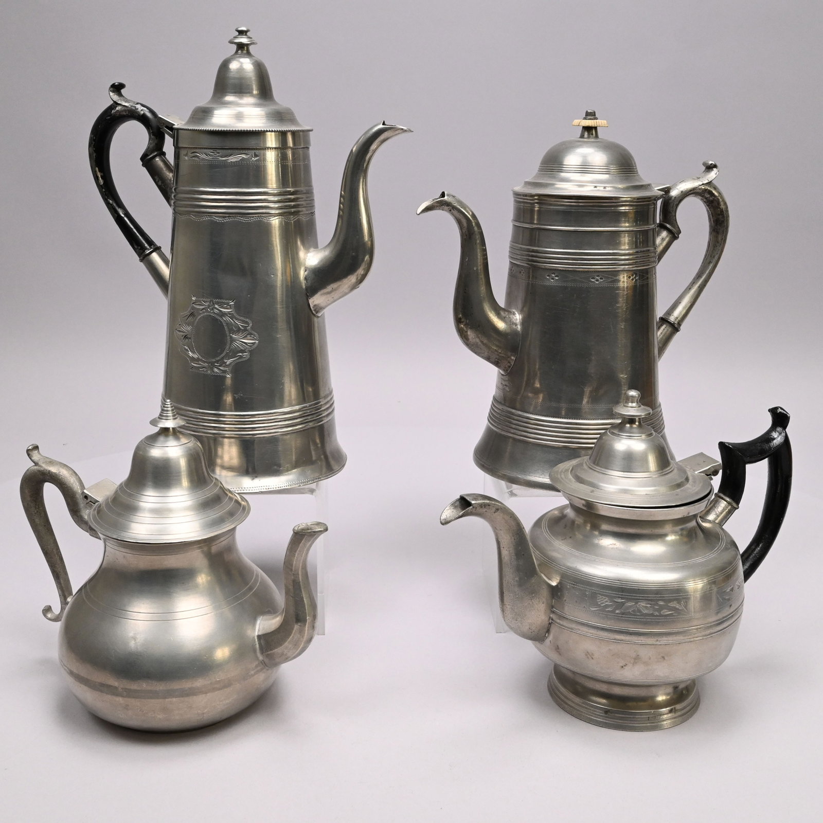 Four Beverley, Massachusetts Tea and Coffeepots: Four Beverley, Massachusetts Tea and Coffeepots. Comprising a teapot, Eben Smith, 1813-56, surrounded by panels engraved with grape bunches, flowers and leaves alternating with trellis diaperwork, "E.