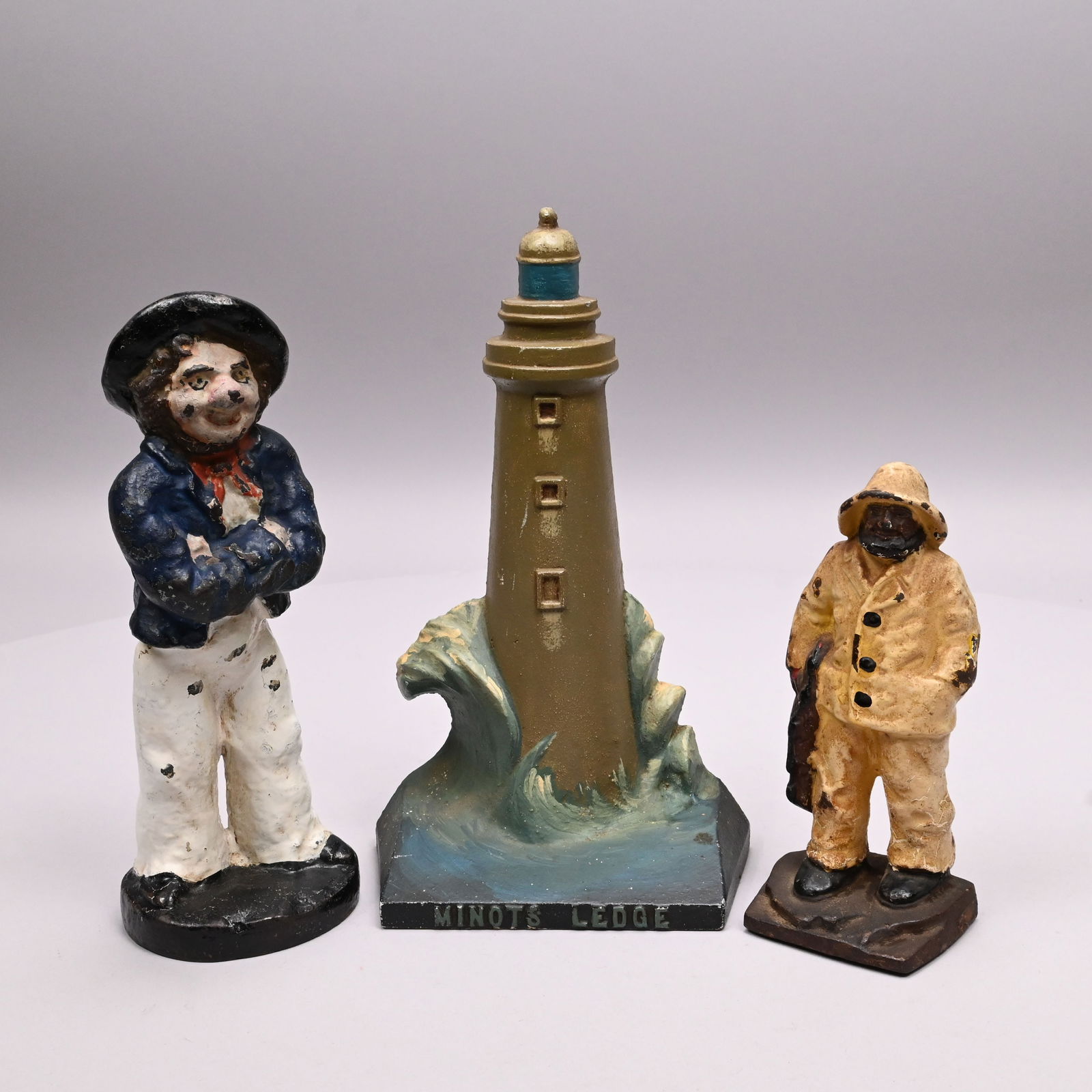 Three English & Amer. Cast-Iron Nautical Doorstops: Three English and American Painted Cast-Iron Nautical Doorstops, Mid - Nineteenth and Twentieth Century. The first two solid cast and full figure, comprising an English sailor wearing a pigtail, John