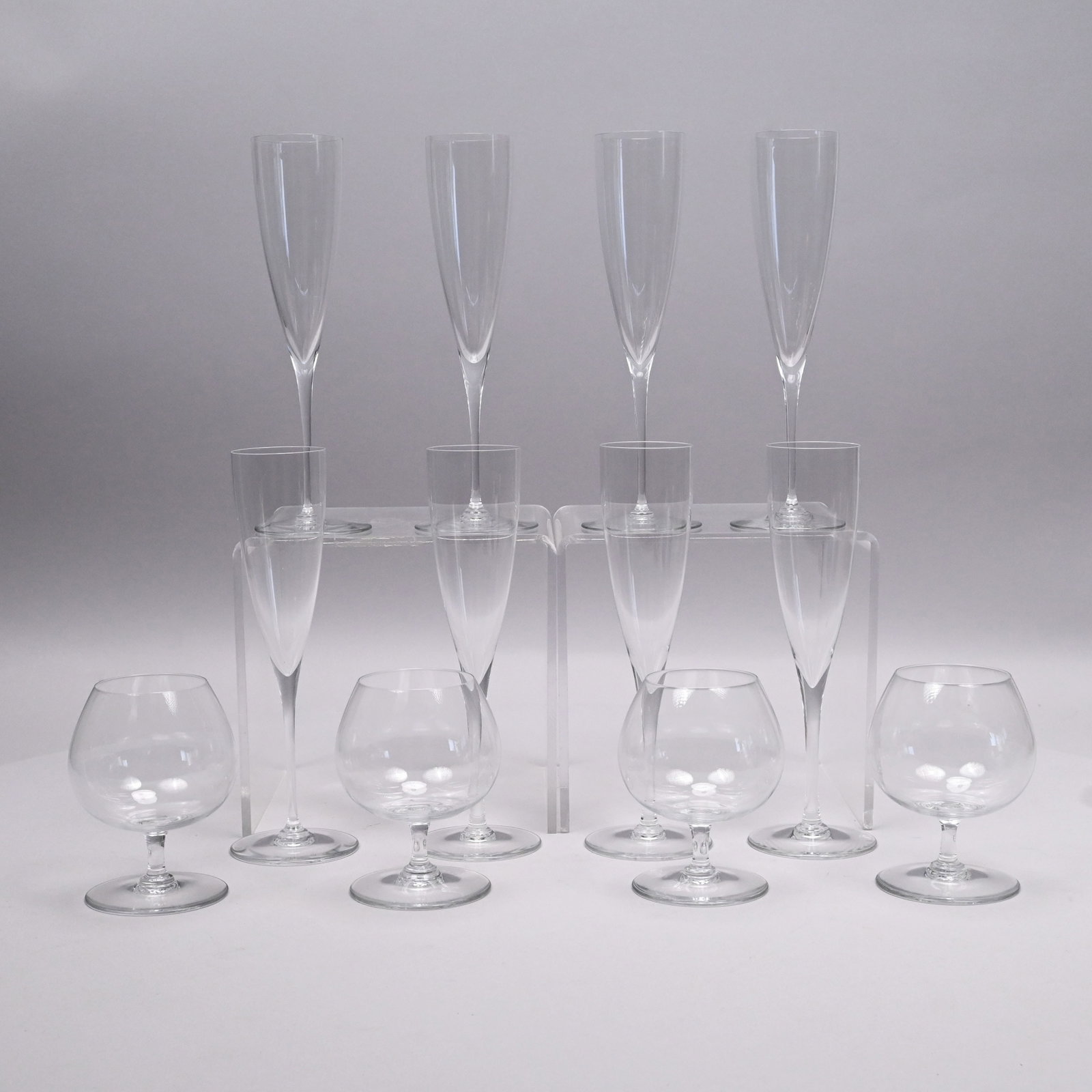 Set Eight French Champagne Flutes,Baccarat Crystal: Set of Eight French Colorless Glass Champagne Flutes and Four Brandy Snifters, Baccarat Crystal, Twentieth Century. Each acid etched with the "BACCARAT FRANCE" wine glass, carafe and goblet circular f