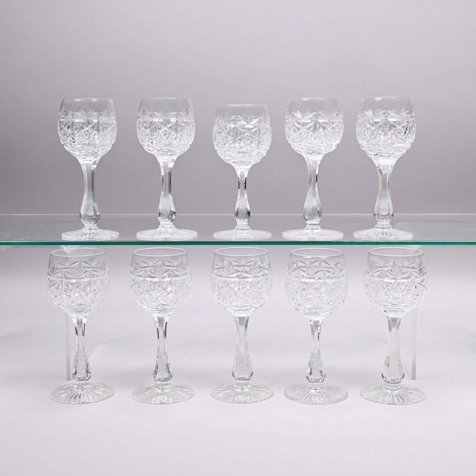 Set Ten 'Sheraton' Cut Glass Wine Glasses, T. Webb: Set of Ten 'Sheraton' Colorless Cut Glass Hock Wine Glasses, Thomas Webb & Sons and Edinburgh Crystal, Twentieth Century. Design n. 53251, each acid-stamped "THOS WEBB ENGLAND." H: 6.875 in., Diam: 2.