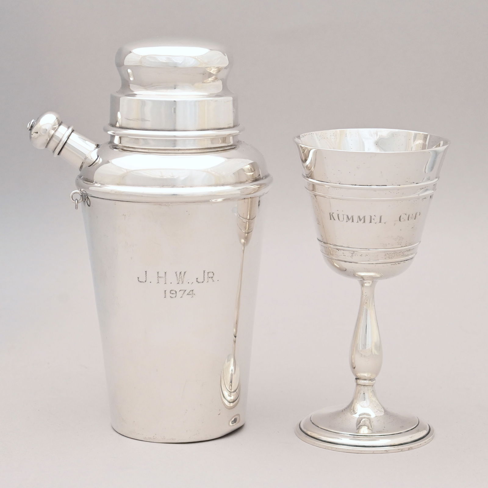 American Silver Cocktail Shaker and a Wine Glass: American Sterling Silver Wine Glass, Black, Starr & Frost and a Cocktail Shaker, Black Starr & Gorham, New York, New York, 1940 - 1962. The wine glass engraved "KUMMEL CUP," the cocktail shaker with t