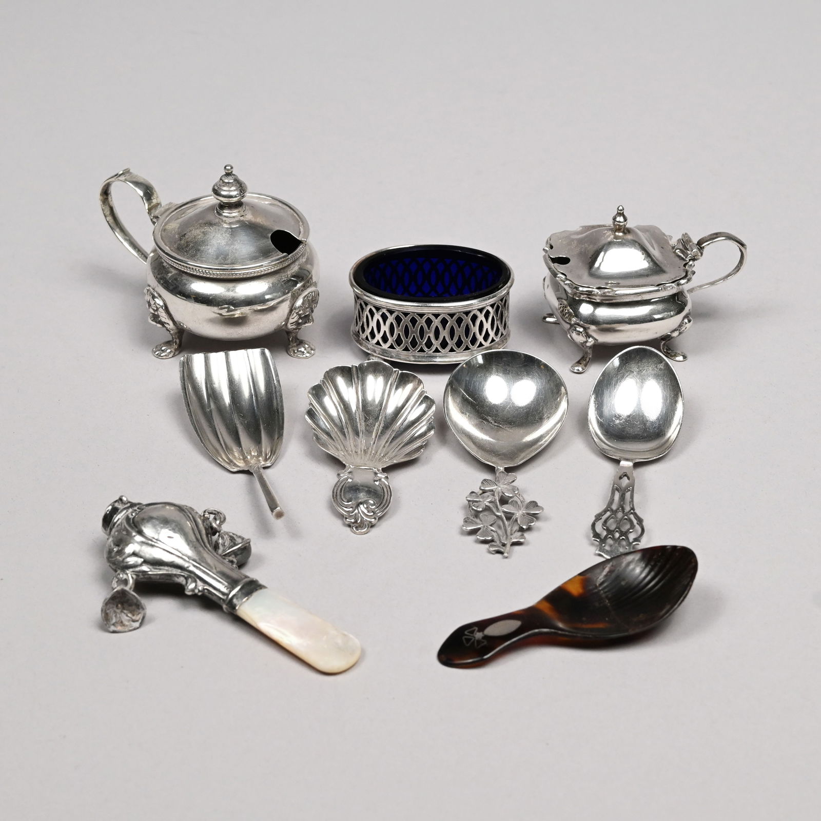 Nine English and American Sterling Silver Wares: Nine English and American Sterling Silver Household Wares, Mid-Nineteenth to Early Twentieth Century. Comprising a George V mustard pot, Mappin & Webb, Ltd., Birmingham,1912-13; a George V salt celler
