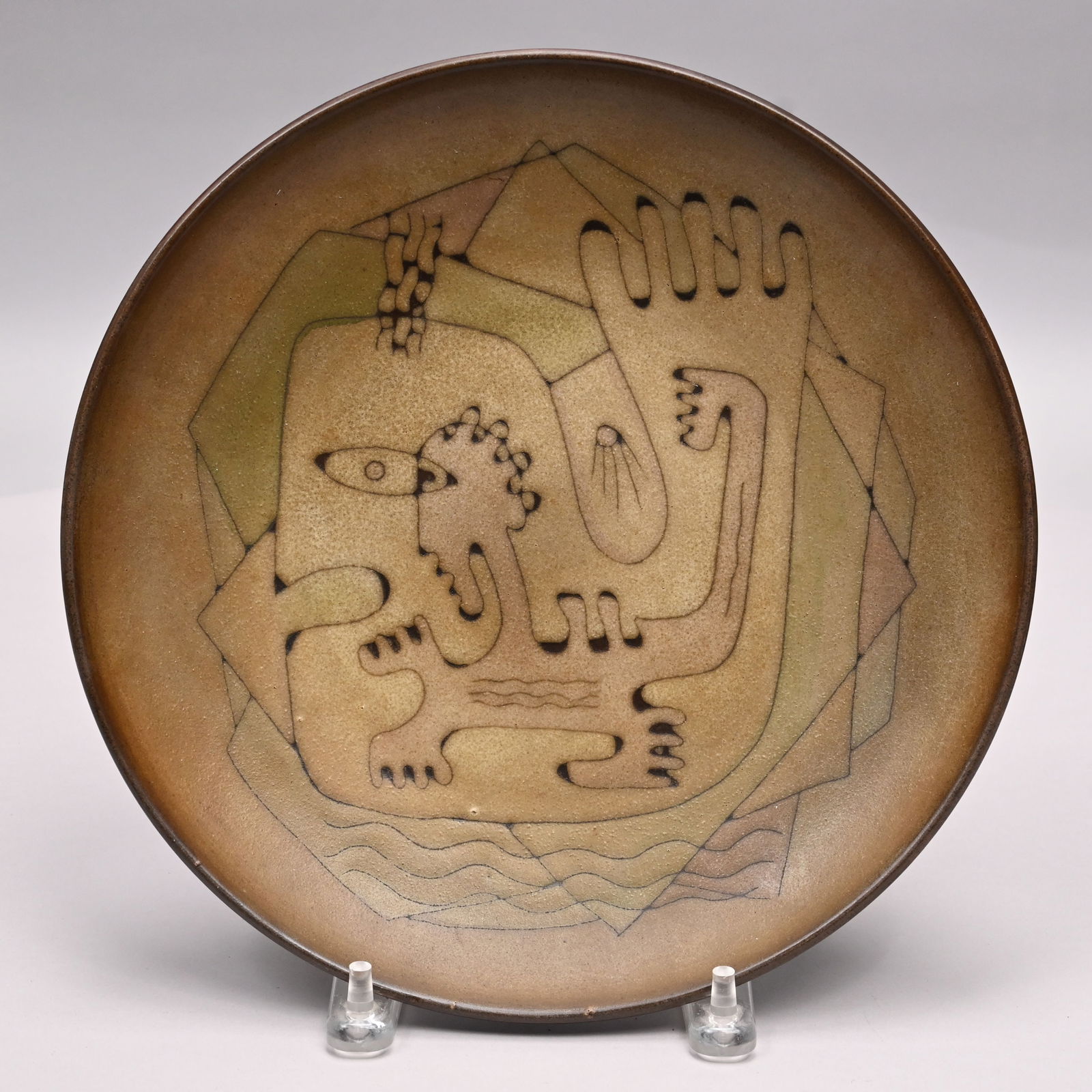 Edwin O. & Mary G. Scheier-'Jonah & Whale' Charger: Edwin O. Scheier (1910-2008) and Mary Goldsmith Scheier (1908-2007), Durham, New Hampshire. Glazed Brown Earthenware 'Jonah and the Whale' Charger, Late 1940s - 1950s. Covered in matte brown and green