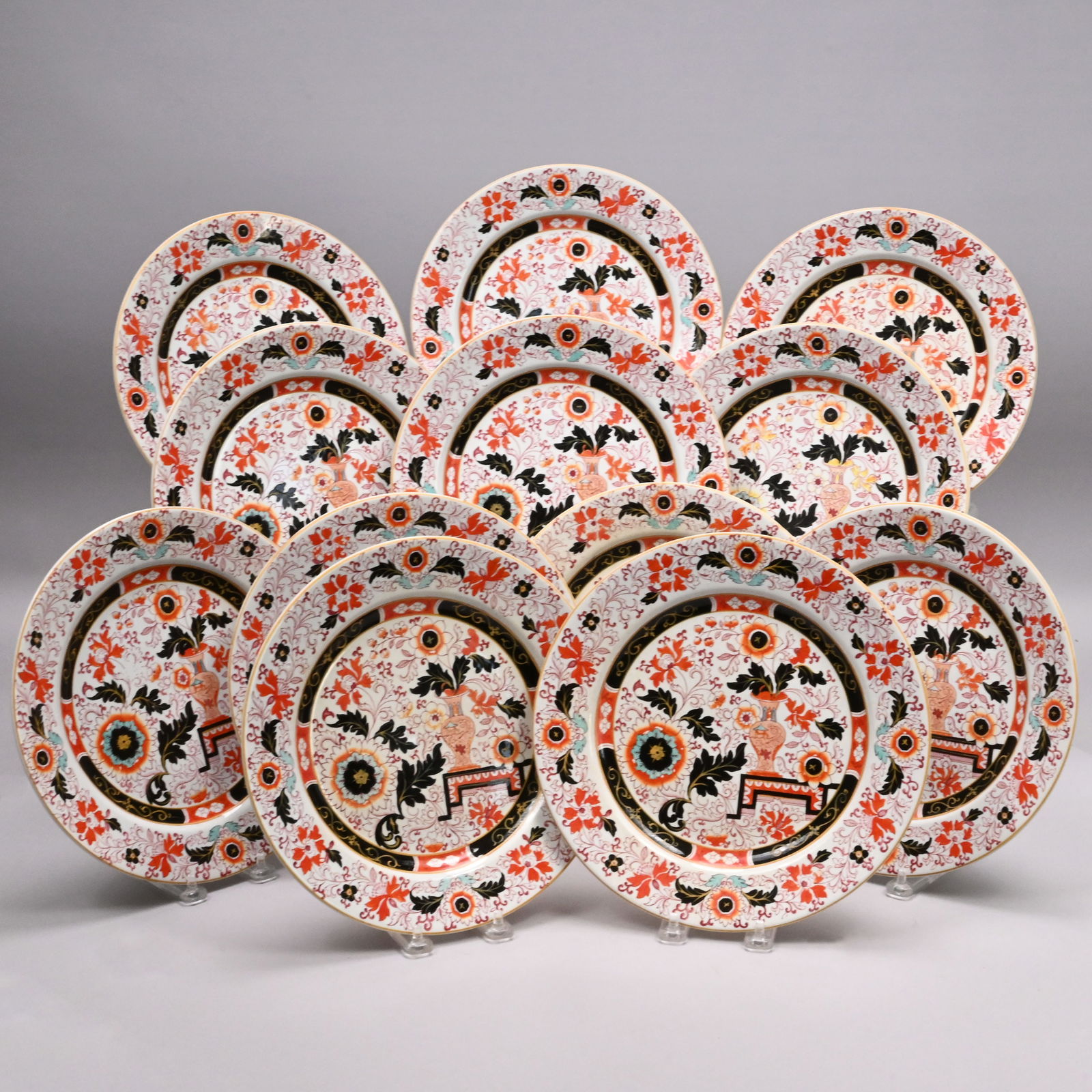 Set of Twelve Staffordshire Ironstone Imari Plates: Set of Twelve Staffordshire Ironstone Transfer-Printed #B 3463 Imari Plates, G.L. Ashworth & Bros., Hanley, 1862 - 1891. Each printed with a vase issuing a tall flowering stem and leaves on a ground o