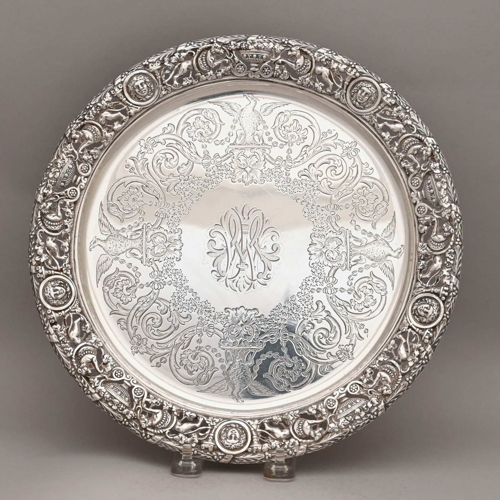Victorian Silver Salver, Mappin & Webb, 1892: Victorian Sterling Silver Salver, Mappin & Webb (John Newton Mappin), London, 1892. Engraved in the center with conjoined foliate initials, surrounded by a wide border of four displayed eagles perched