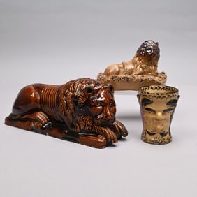Two American Figures of Lions and a Satyr Cup