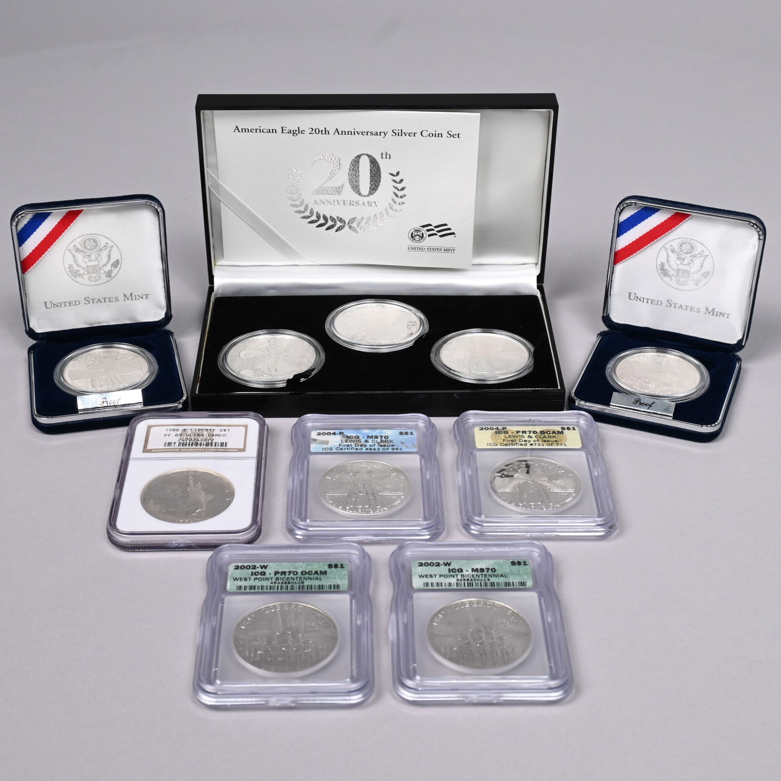 Ten US Silver Commemorative Silver Dollars: Ten US Silver Commemorative Silver Dollars, including 1986-S Liberty Proof Ultra Cameo, PF69 (NGC); 2002-W West Point Bicentennial, MS70 (ICG), 2002-W West Point Bicentennial Proof Deep Cameo, PF70 (I