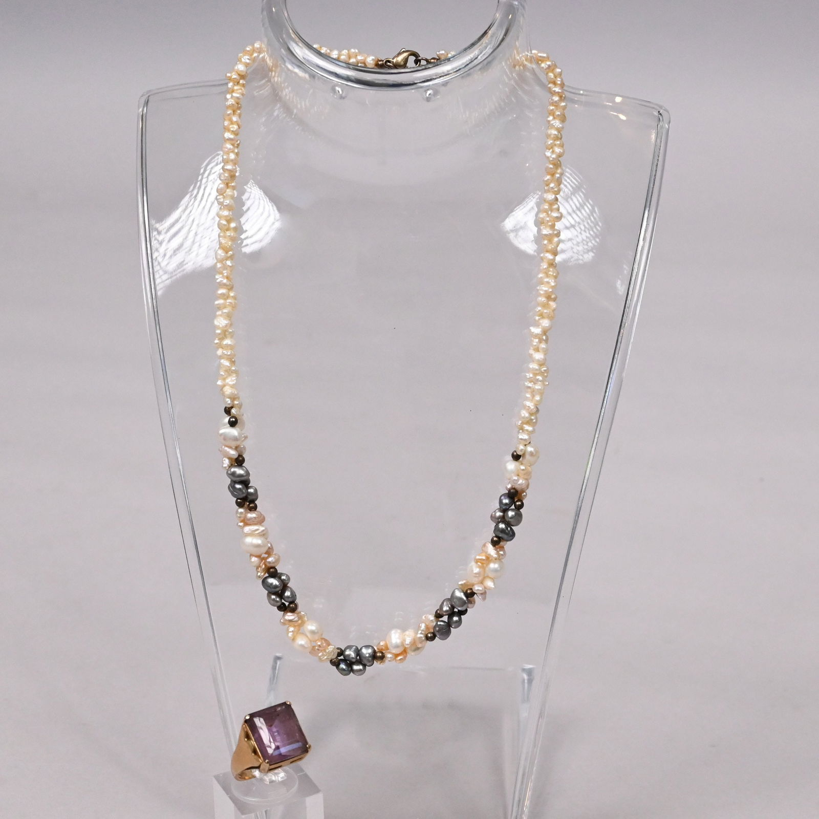 Seed Pearl Necklace & 14k Gold and Amethyst Ring: Seed Pearl Necklace and a 14k Yellow Gold and Pale Amethyst Ring. The ring marked "14k".Ring 5.6gRing size: 4-1/2Necklace: L: 16 in.