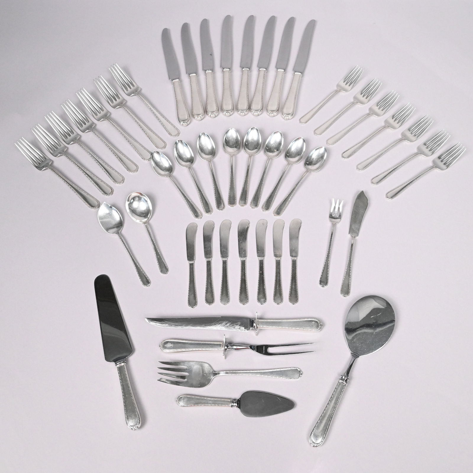 American Sterling Silver Flatware Service: American Sterling Silver 'Pine Tree' Flatware Service, International Silver Co., Meriden, Connecticut, Designed by Frederick W. Stark, 1927-1974. Comprising seven 6.125-inch salad forks, seven