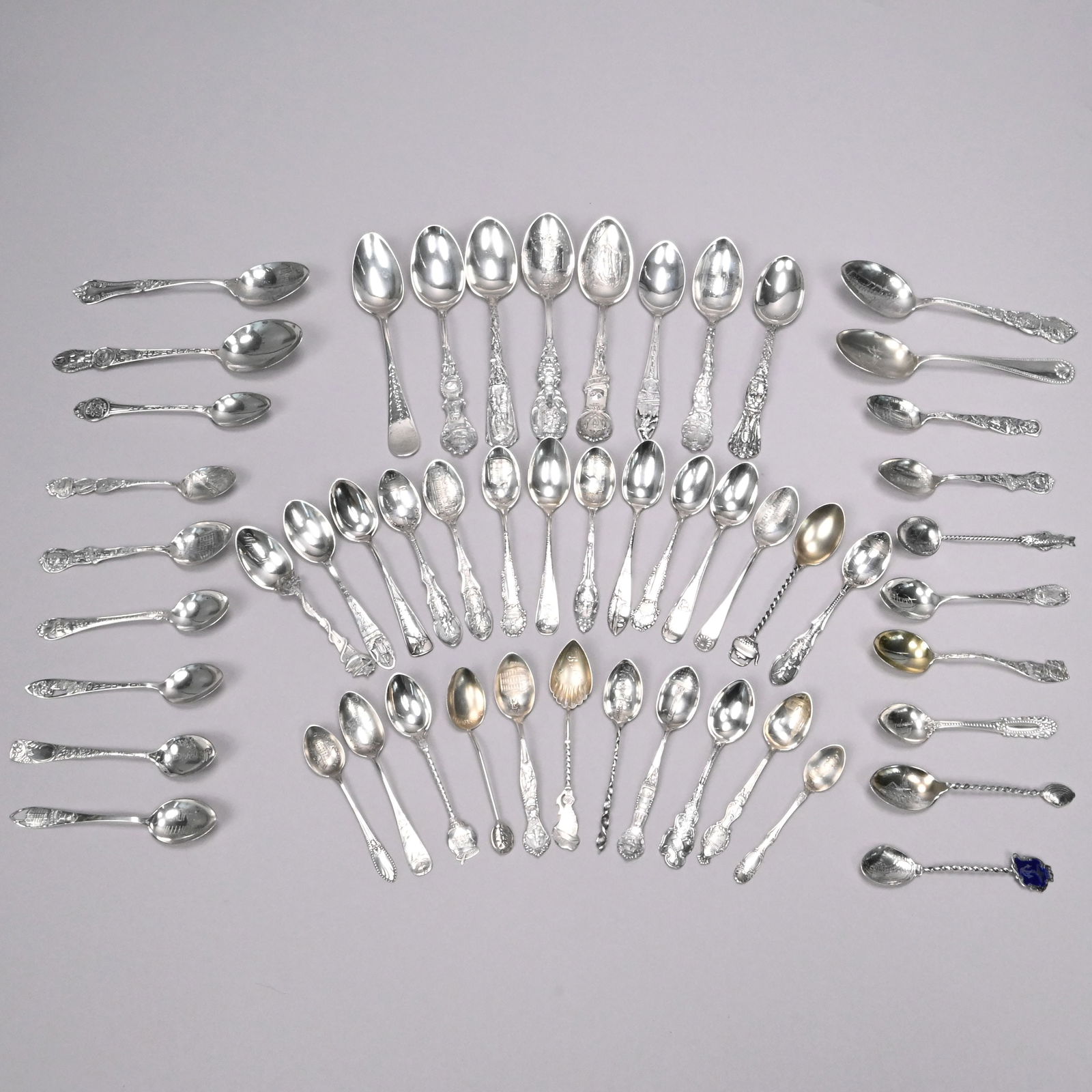 Large Group of New England Silver Souvenir Spoons: Large Group of New England Silver and Silver-Gilt Souvenir Spoons, Various Makers, Late 19th-20th Century. Comprising a Massachusetts group with three spoons from Salem (each depicting a witch), six