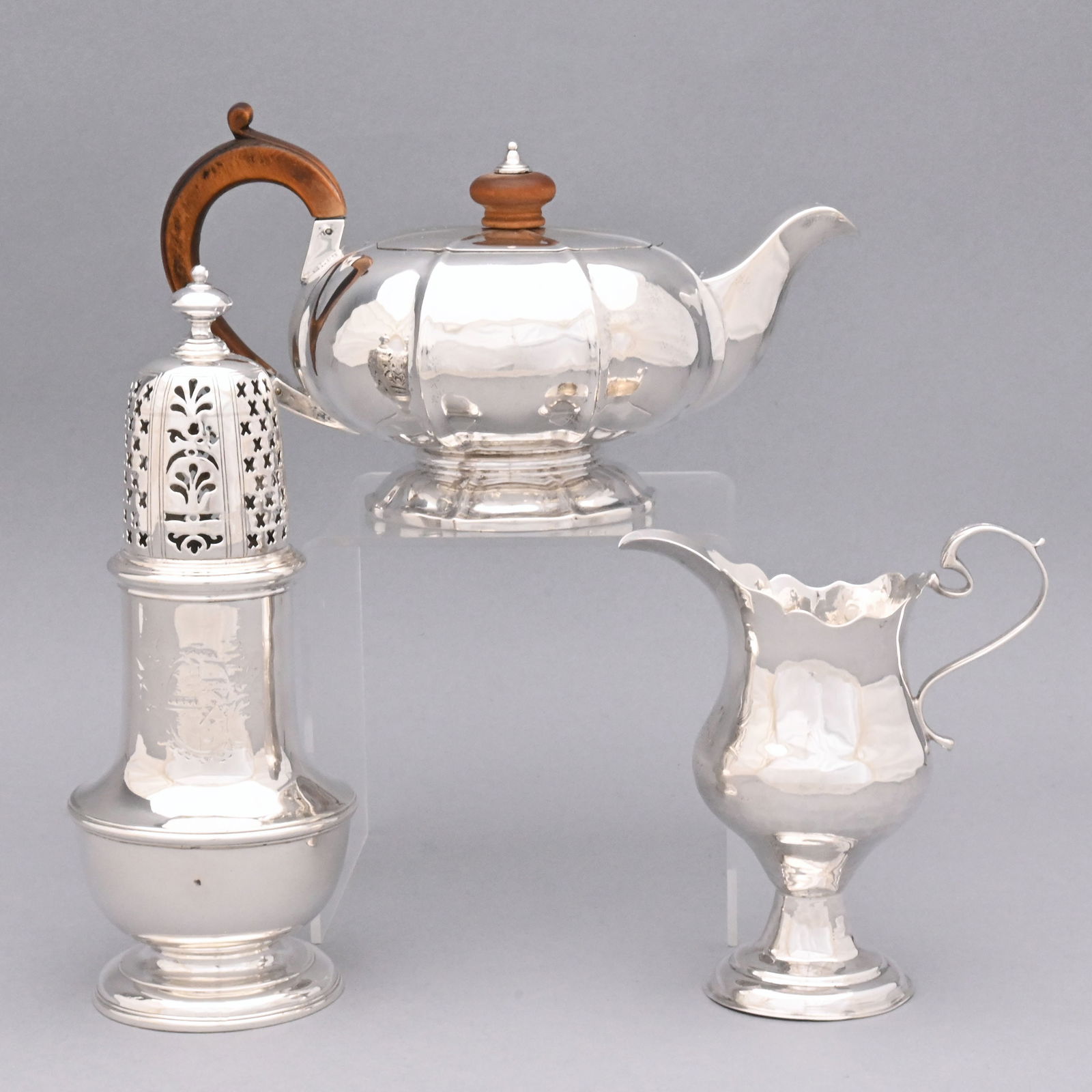 Three George II, III and IV Silver Serving Wares: Three George II, III and IV Sterling Silver Serving Wares, Early 18th-Early 19th Century. Comprising a George II caster, Thomas Bamford, London, 1734, of urn form, faint engraved coat-of-arms, the