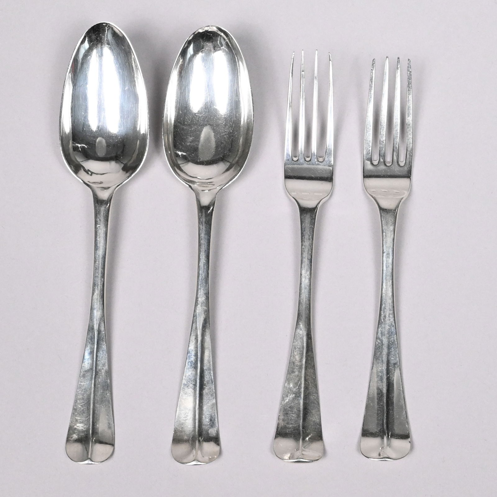 Dutch Silver 'Hanoverian' Tablefork and Tablespoon: Dutch Silver 'Hanoverian' Tablefork and Tablespoon, Various Makers, Late 18th Century. Each spoon with rattail bowl, each utensil marked back of the handle above the bowl, one fork with maker's