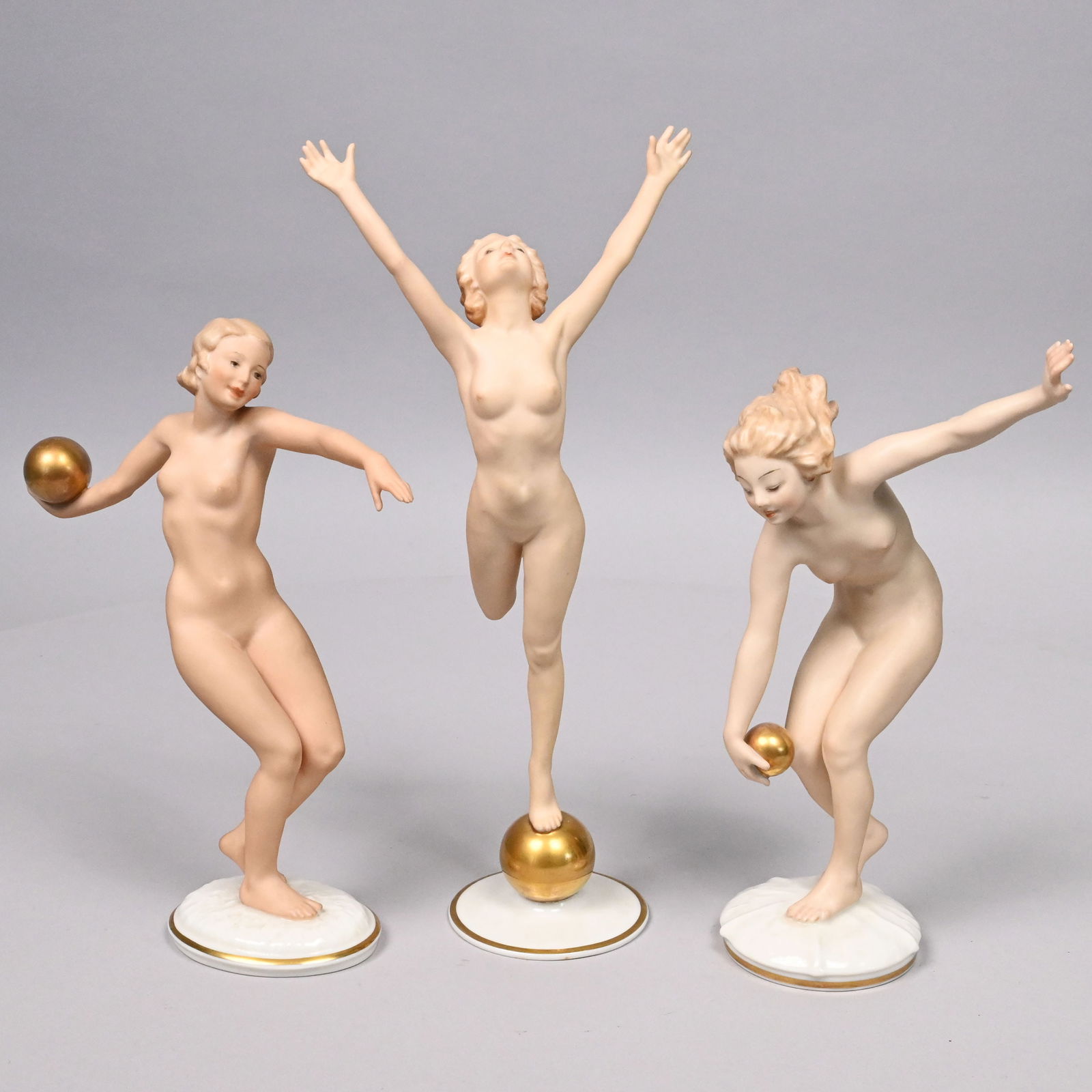 Three Hutschenreuther Porcelain Athletic Figures: Three Hutschenreuther Porcelain Factory Figures of Female Athletes,' Karl Tutter and Carl Werner, Selb, Germany, 1930s. In white blanc-de-chine and matte flesh colors, comprising 'The Sun Child,"