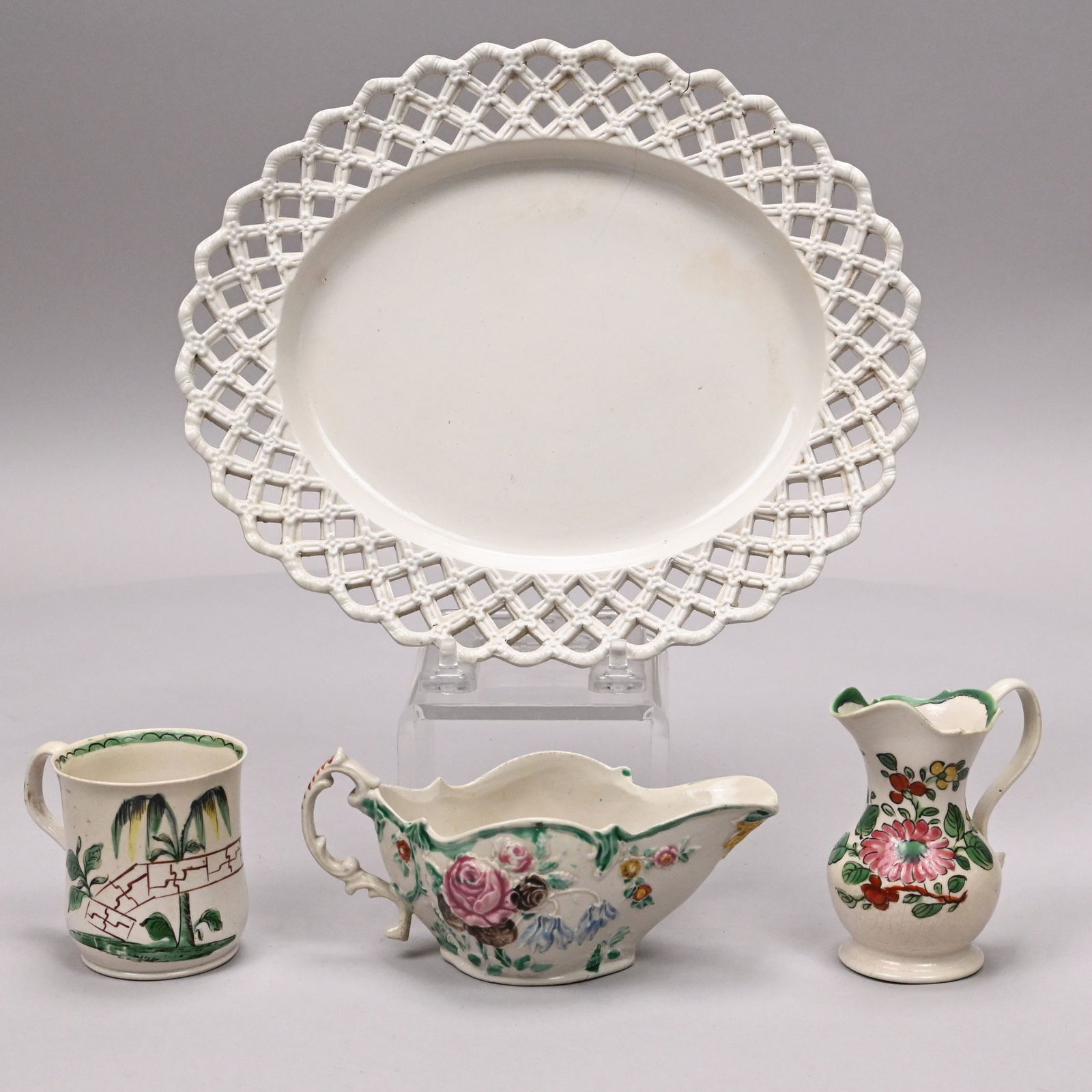 Four Staffordshire Saltglaze Stoneware Articles: Four Staffordshire Saltglaze Stoneware Articles, 1760-1765. Three decorated in rose, blue, green, yellow and brown enamels and comprising an 'Acacia' coffee can painted with a flower stem, acacia or w