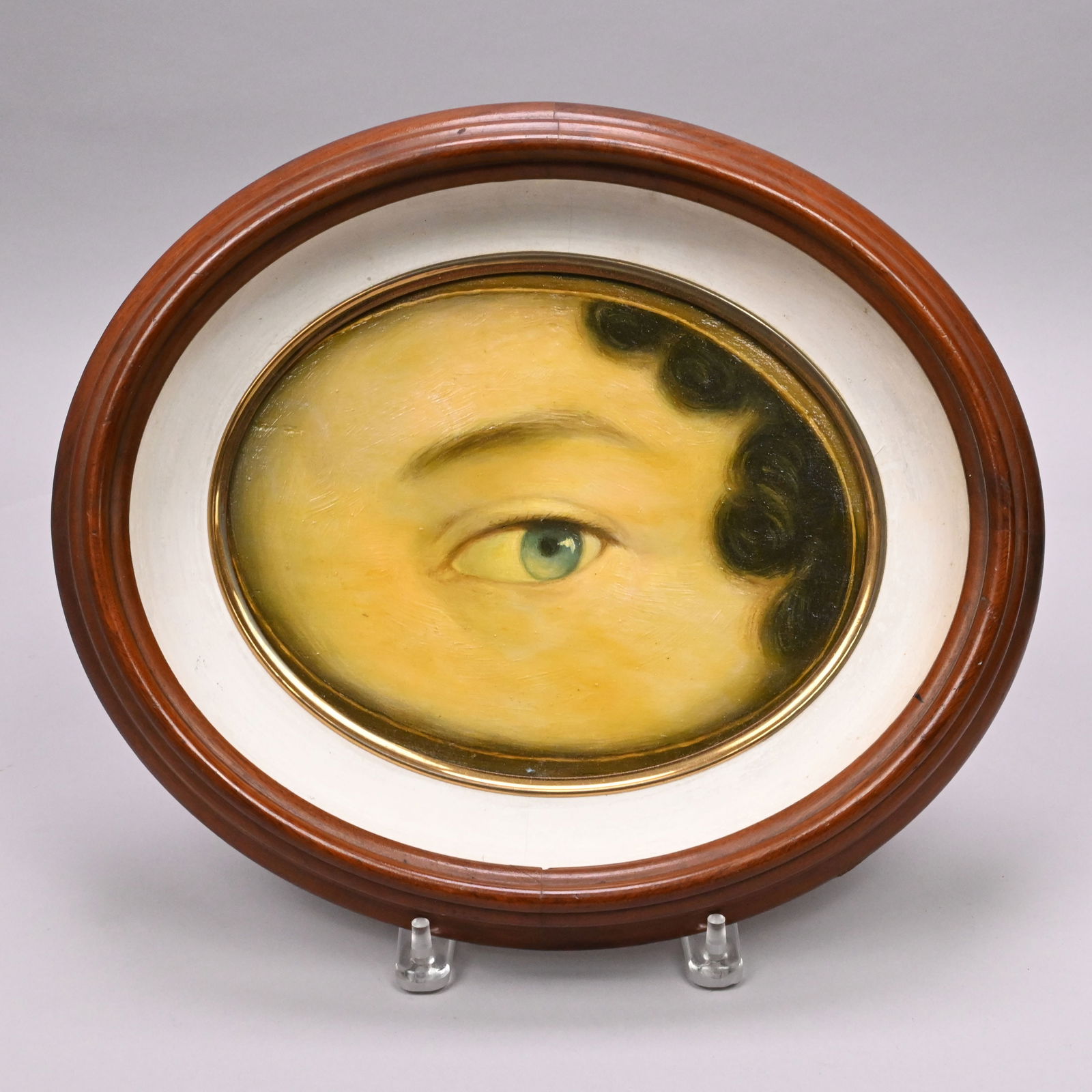 Oval "Lover's Eye": Oval "Lover's Eye". Oil on board, reverse affixed with wood stenciled "Dupee & Co./ 286 Congress St./ Opp. Preble House/ Portland ME."Frame: H: 12 in., W: 14 in., D: 2.25 in.