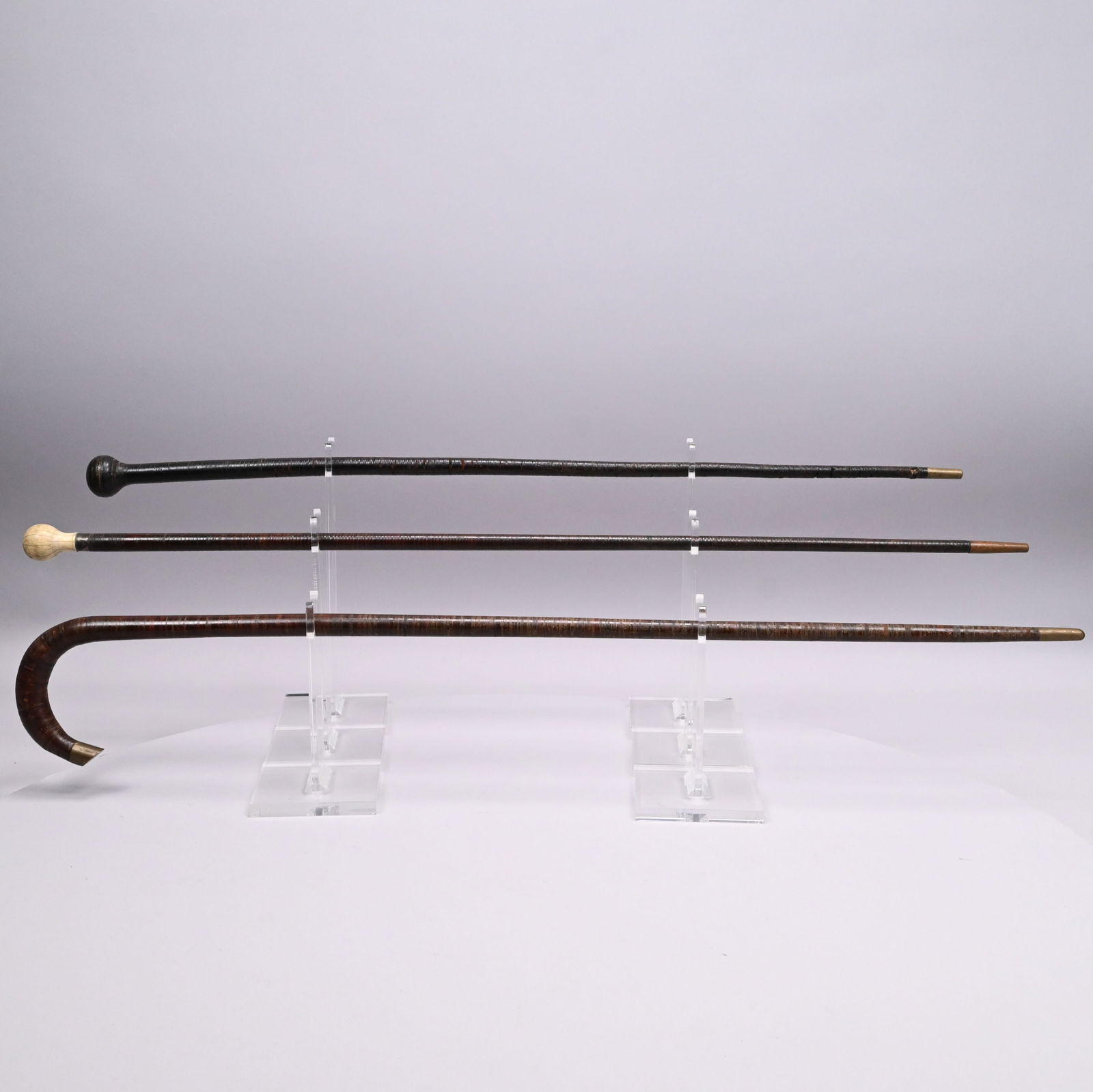 Two Leather-Wrapped Walking Sticks and a Cane (1 of 10)