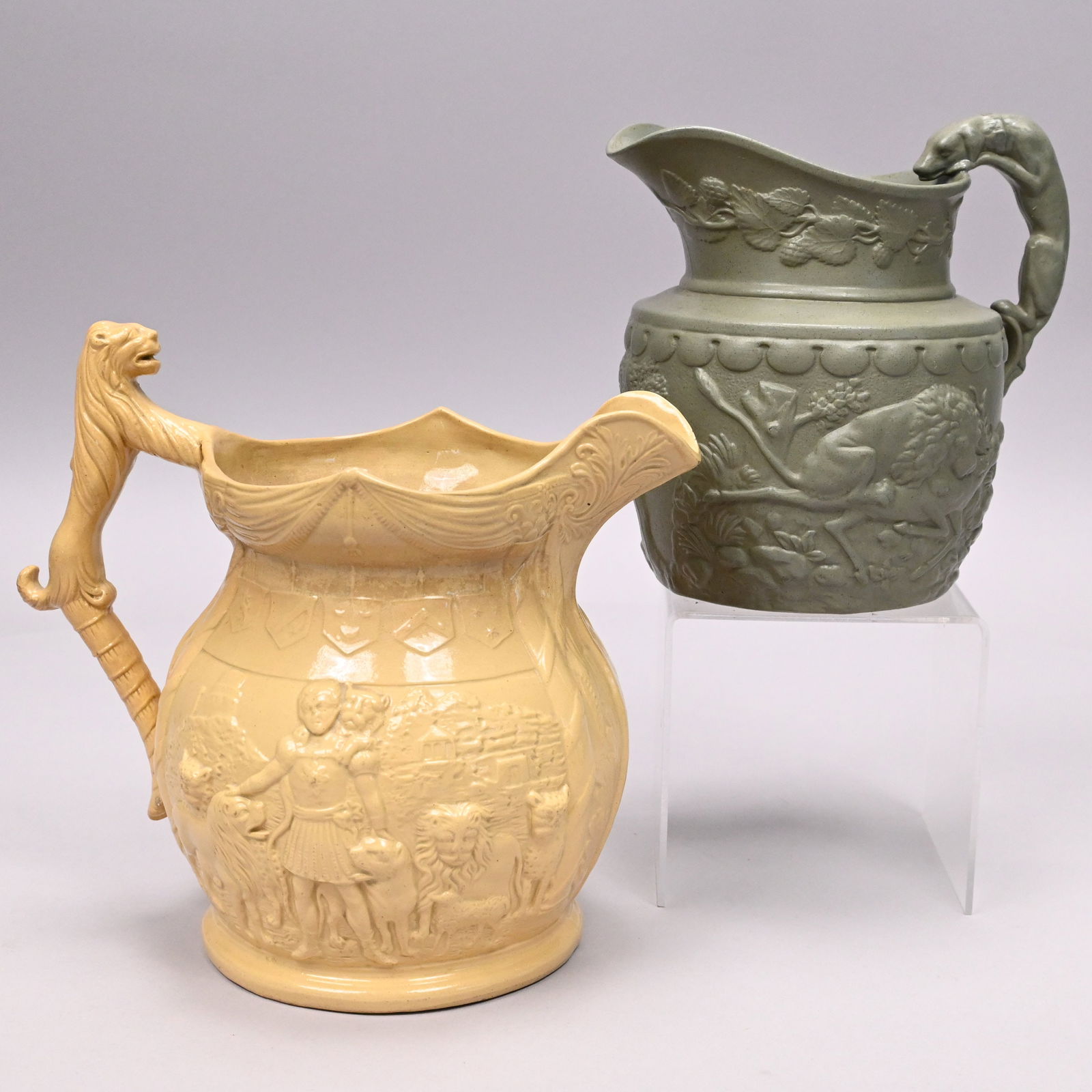 Staffordshire Stoneware Jug & Yellow Ware Pitcher: Staffordshire Stoneware Green Drabware 'Boar and Stag Hunt' Pitcher, William Ridgway & Co., 1834-1854; and a 'Van Amburgh, the Lion Tamer' Yellow Ware Pitcher, Circa 1840. The first molded on one