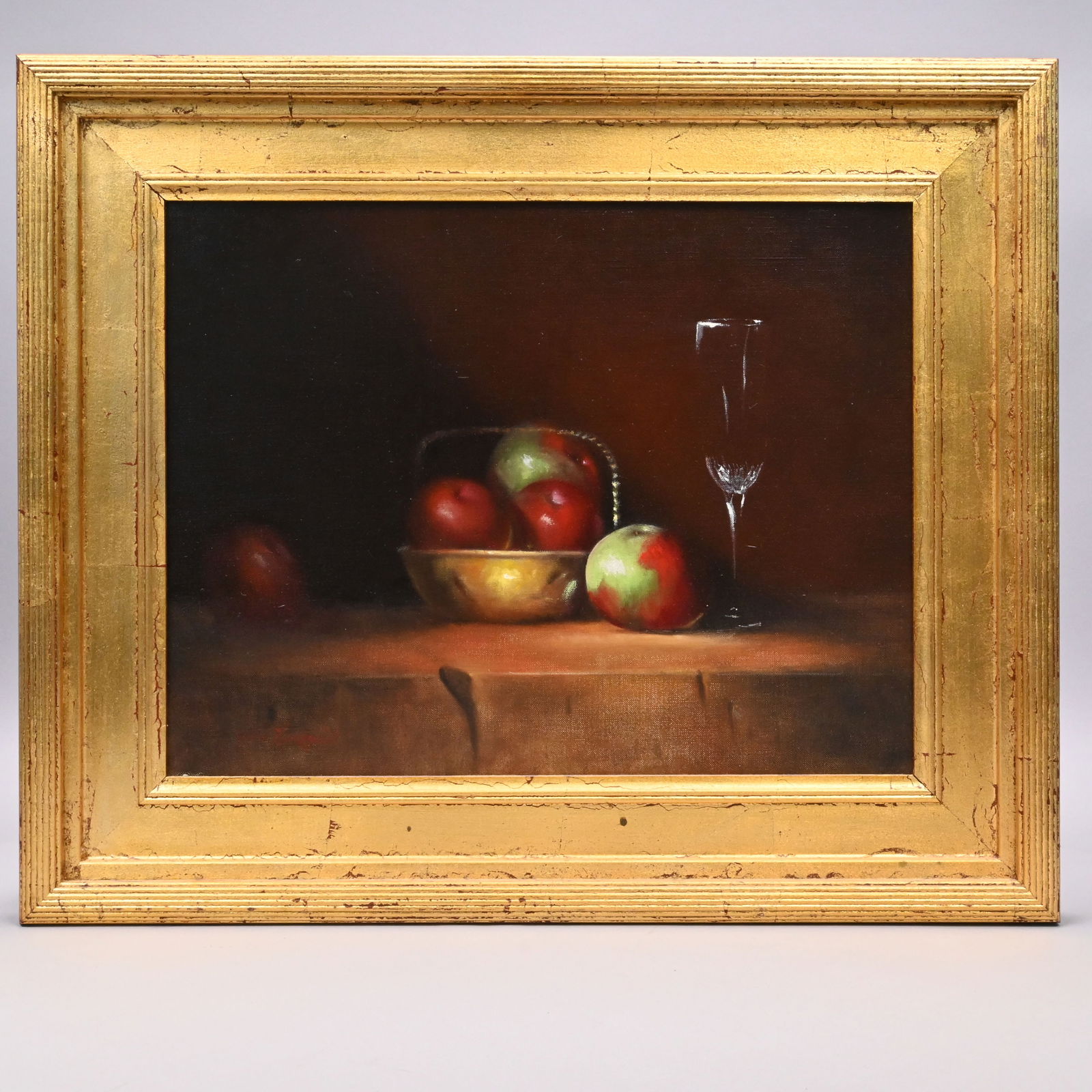 John Lundquist -Still-Life w/Bowl, Apples and Wine: John Lundquist (American, Contemporary). Still-Life with Brass Bowl, Apples and Wine Glass. Oil on canvas, signed "John Lundquist" lower left, (14 x 17.75 inches).Frame: H: 20 in., W: 24 in., D: 2 in.