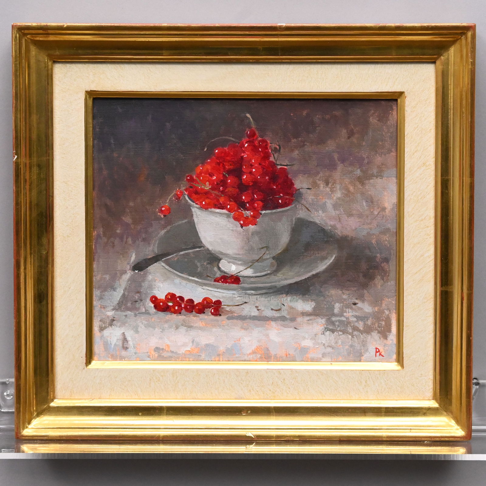 Pamela Kay - "Redcurrants in a Cup and Saucer": Pamela Kay (b. 1939, Isle of Sheppey, Kent, England). "Redcurrants in a Cup and Saucer." Oil on panel, signed with the initials "PK" lower right, (8.5 x 9.75 inches, sight).Frame: H: 12.625 in., W: