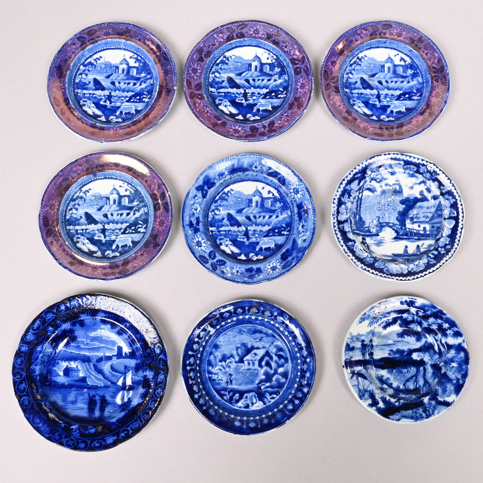 Nine Staffordshire Dark Blue Printed Cup Plates: Nine Staffordshire Dark Blue Transfer-Printed Cup Plates, 1817-1846. Comprising one "Chatting" 3.5-inch cup plate and one 'Foliage and Scroll Border' series, "Sailboat" 4.375-inch cup plate, both