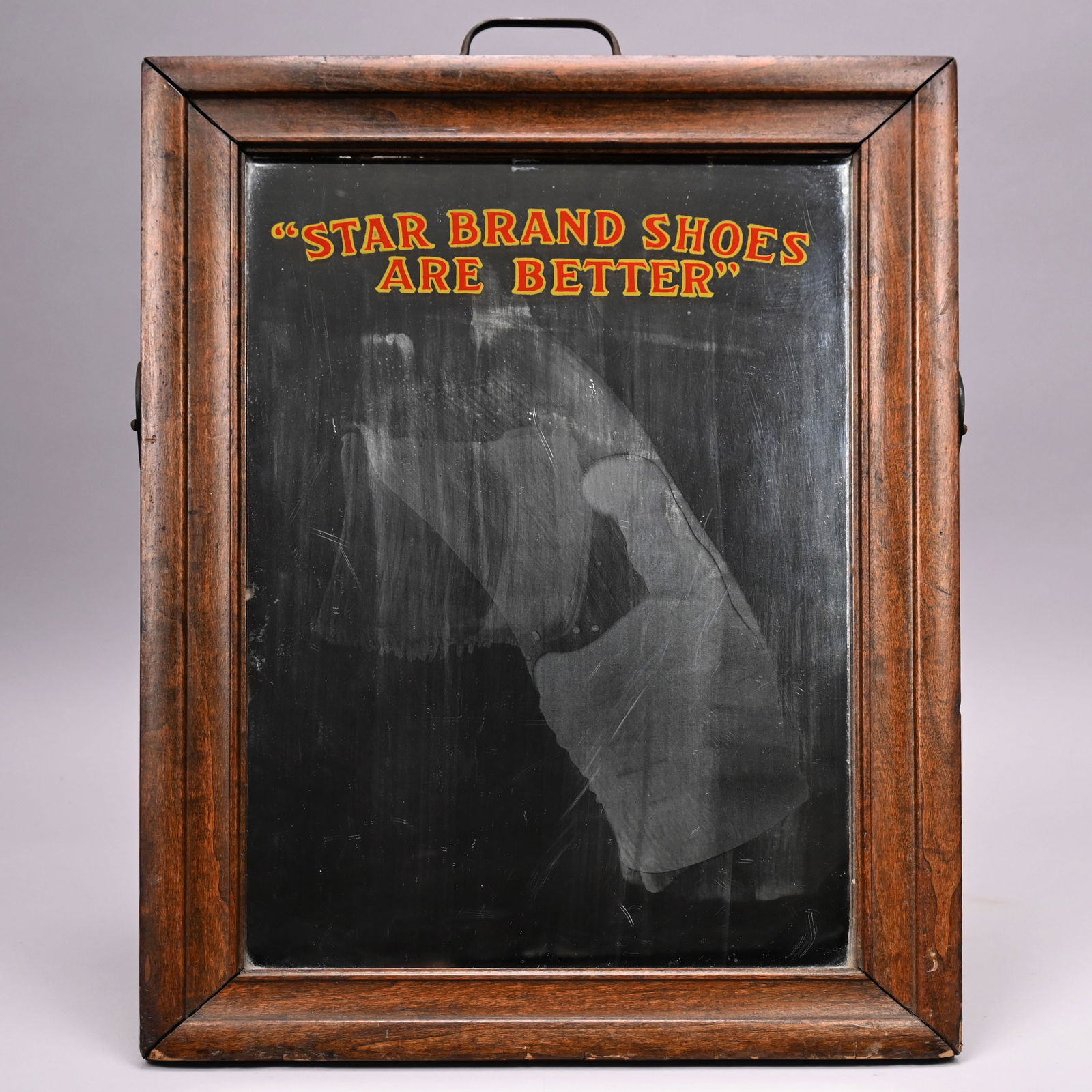 "Star Brand Shoes" Advertising Sign: "Star Brand Shoes" Walnut-Stained Poplar Advertising Easel Sign, Roberts, Johnson and Rand Shoe Company, St. Louis, Missouri, Early 20th Century. The rectangular mirror plate applied on the inside
