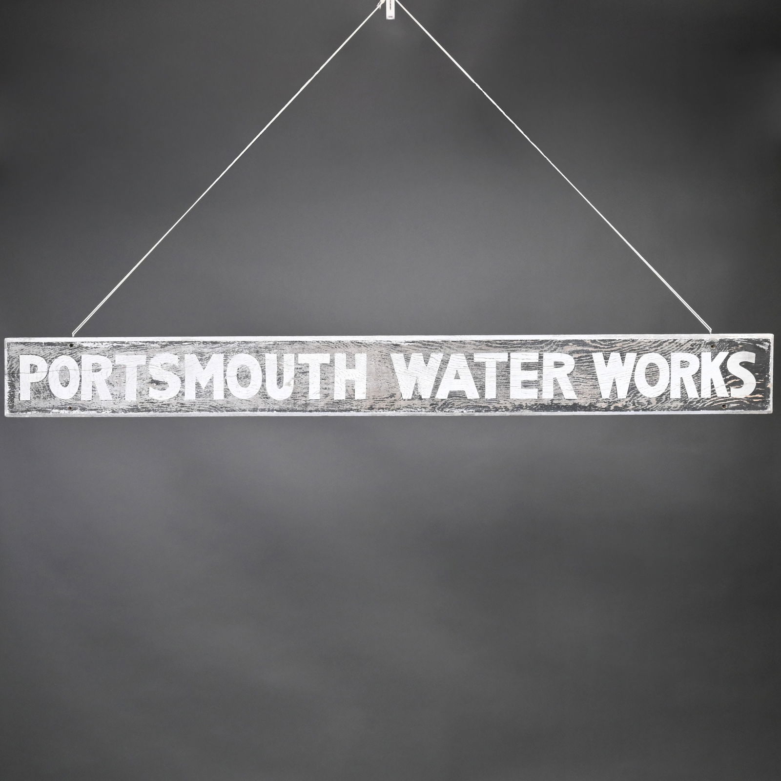 "PORTSMOUTH WATER WORKS" Painted Wood Sign: "PORTSMOUTH WATER WORKS" Painted Wood Sign, From Portsmouth, New Hampshire.H: 7 in., L: 67.25 in., D: 0.75 in.