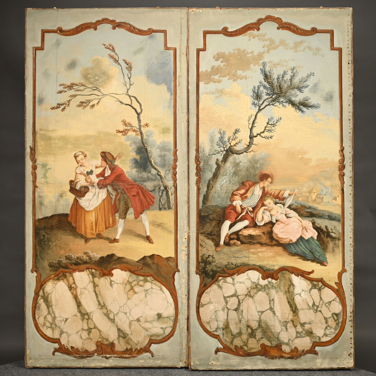 Pair of Double-Sided Painted Theatrical Screens: Pair of Double-Sided Painted Theatrical Screens. The front depicting young lovers in the style of Francois Boucher above a vacant marbleized cartouche; reverse with an architectural rendering of