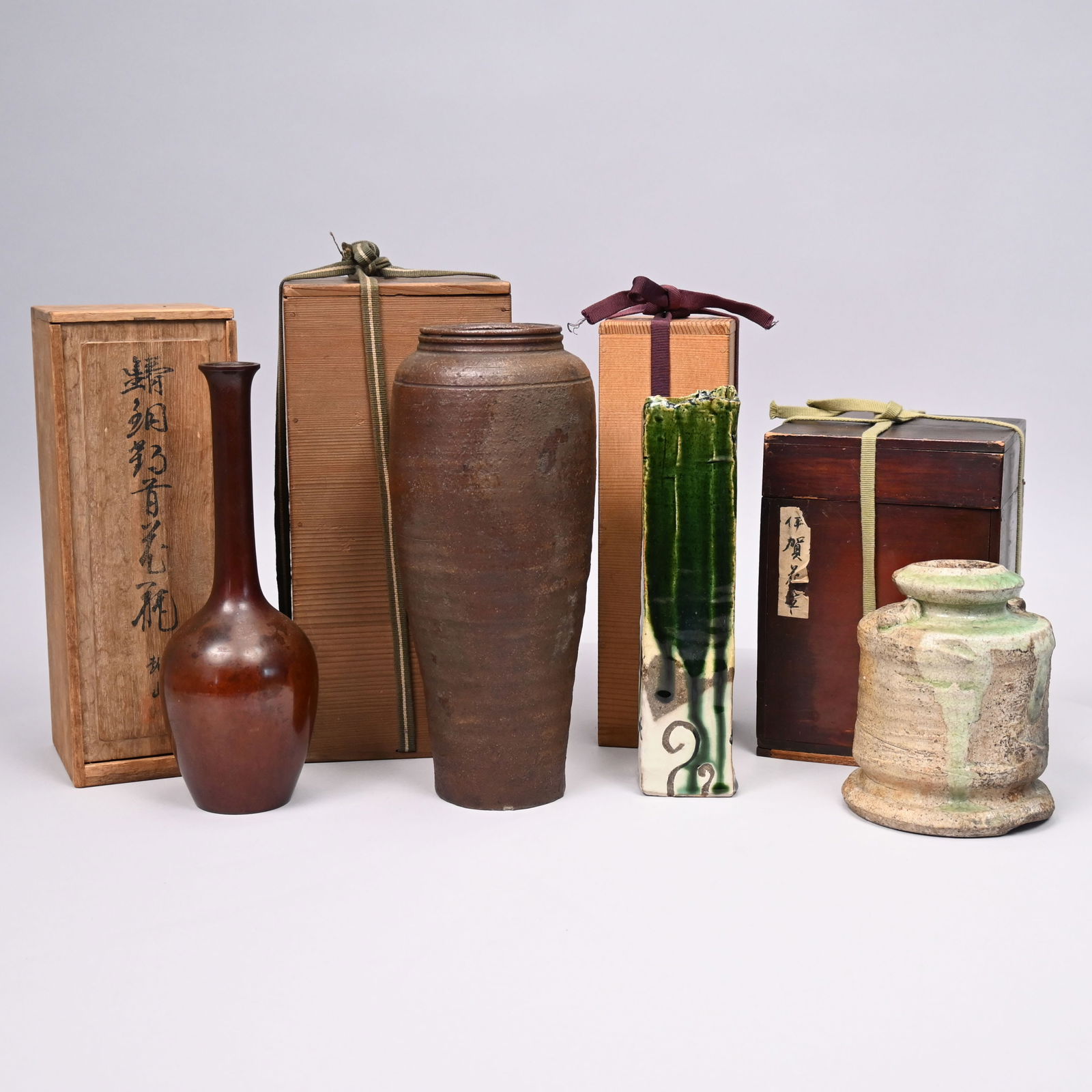 Four Japanese Glazed Earthenware & Stoneware Vases: Four Japanese Glazed Earthenware & Stoneware Vases, 20th Century. Each in an inscribed box.Largest vase: H: 11.375 in., Diam: 4.75 in.Box: H: 12.375 in., W: 5.75 in., D: 5.625 in.