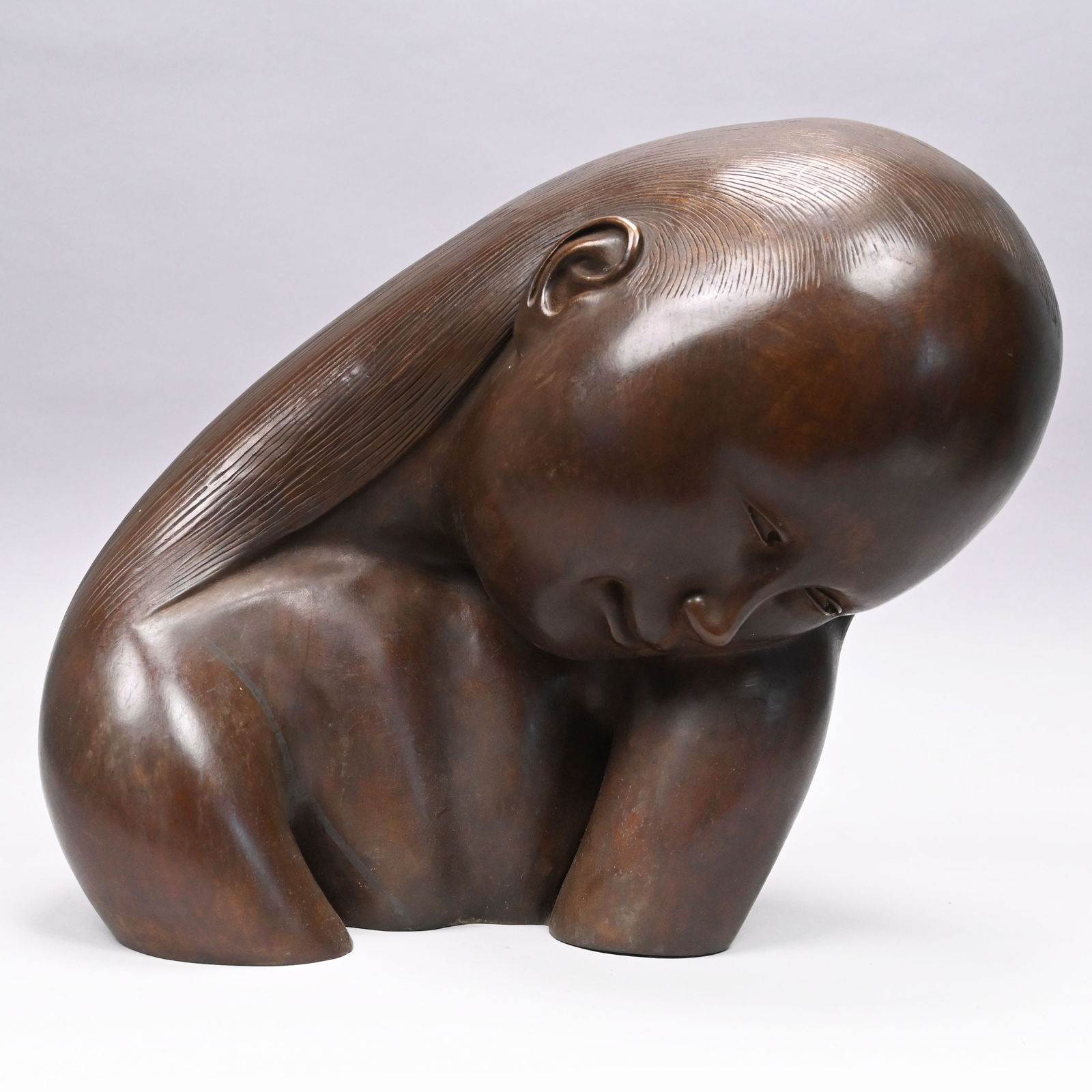Hugo Robus - Head of a Woman: Hugo Robus (American, 1885-1964). Patinated-Bronze Head of a Woman. In medium brown patina, signed "HUGO ROBUS" on the reverse.H: 12 in., W: 13.75 in., D: 9.25 in.Provenance: Roman Bronze Works