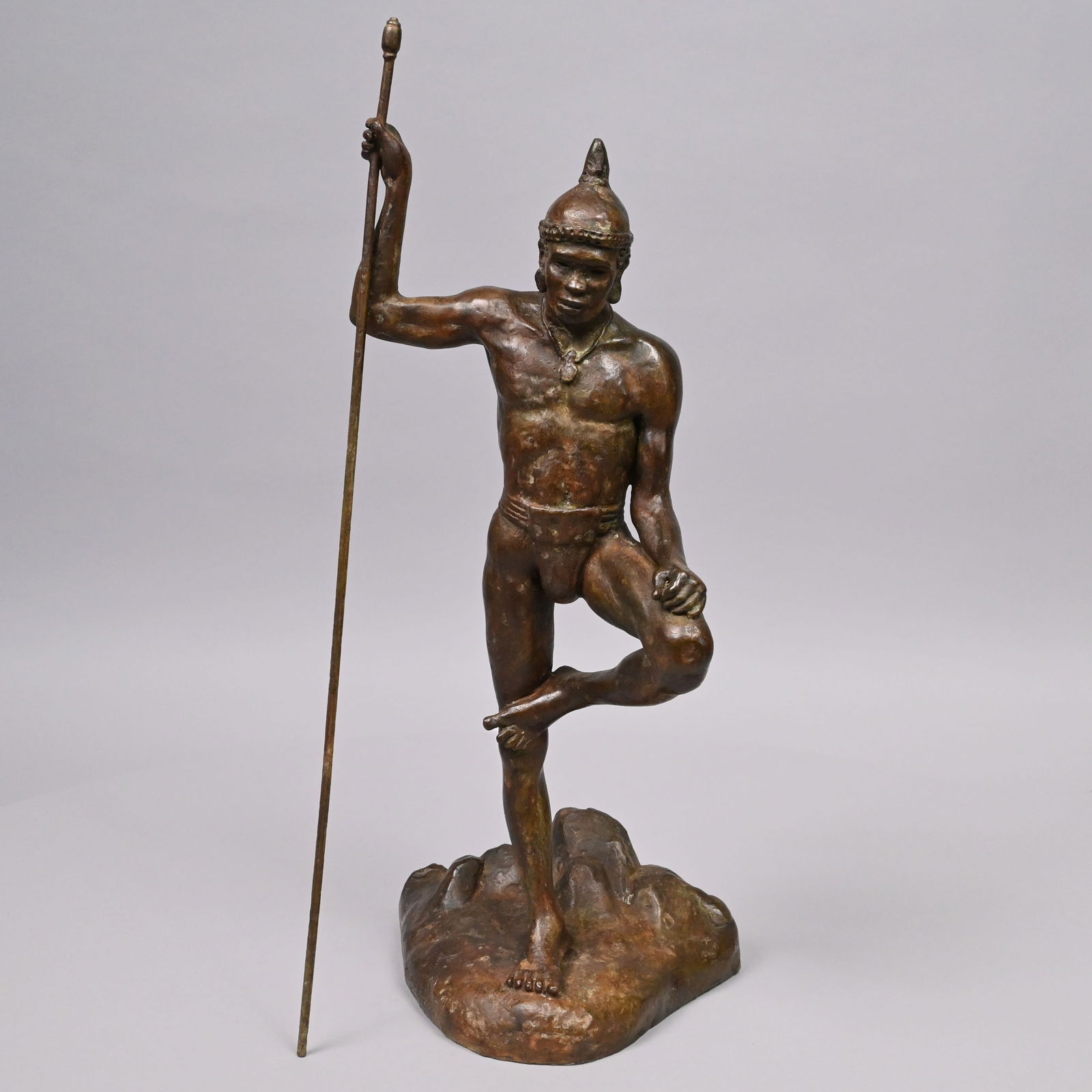 Figure of an African or Southeast Asian Warrior: Figure of an African or Southeast Asian Warrior, 1950. Patinated-bronze figure cast wearing a helmet and carrying a sarissa, signed and dated "CLARK 50" on one side of the base and "1950" on the back.