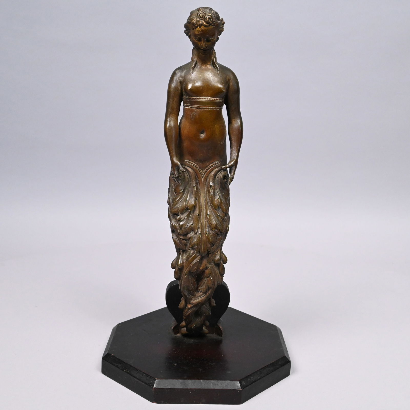 Art Nouveau Patinated-Bronze Figure of a Mermaid: Art Nouveau Patinated-Bronze Figure of a Mermaid, in the Manner of Emmanuel Villanis, Late 19th Century. Cast with curved acanthus leaf tail, mounted on an octagonal wood base in black paint.Bronze: