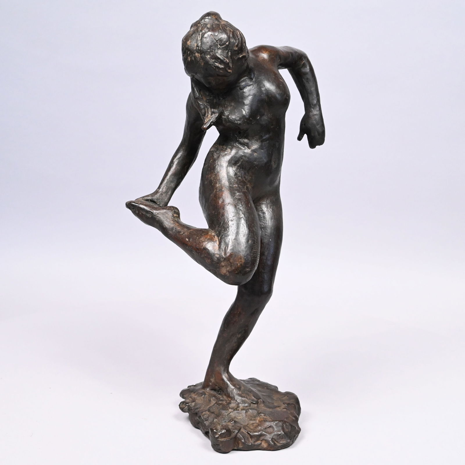 Attributed to Mario Korbel - Nude Holding Her Foot: Attributed to Mario Joseph Korbel (Czechoslovakian/ American, 1882-1954). Nude Holding Her Foot, Patinated Bronze Figure. In dark brown-gold patina, unsigned.H: 18 in., L: 8.625 in., W: 8.375