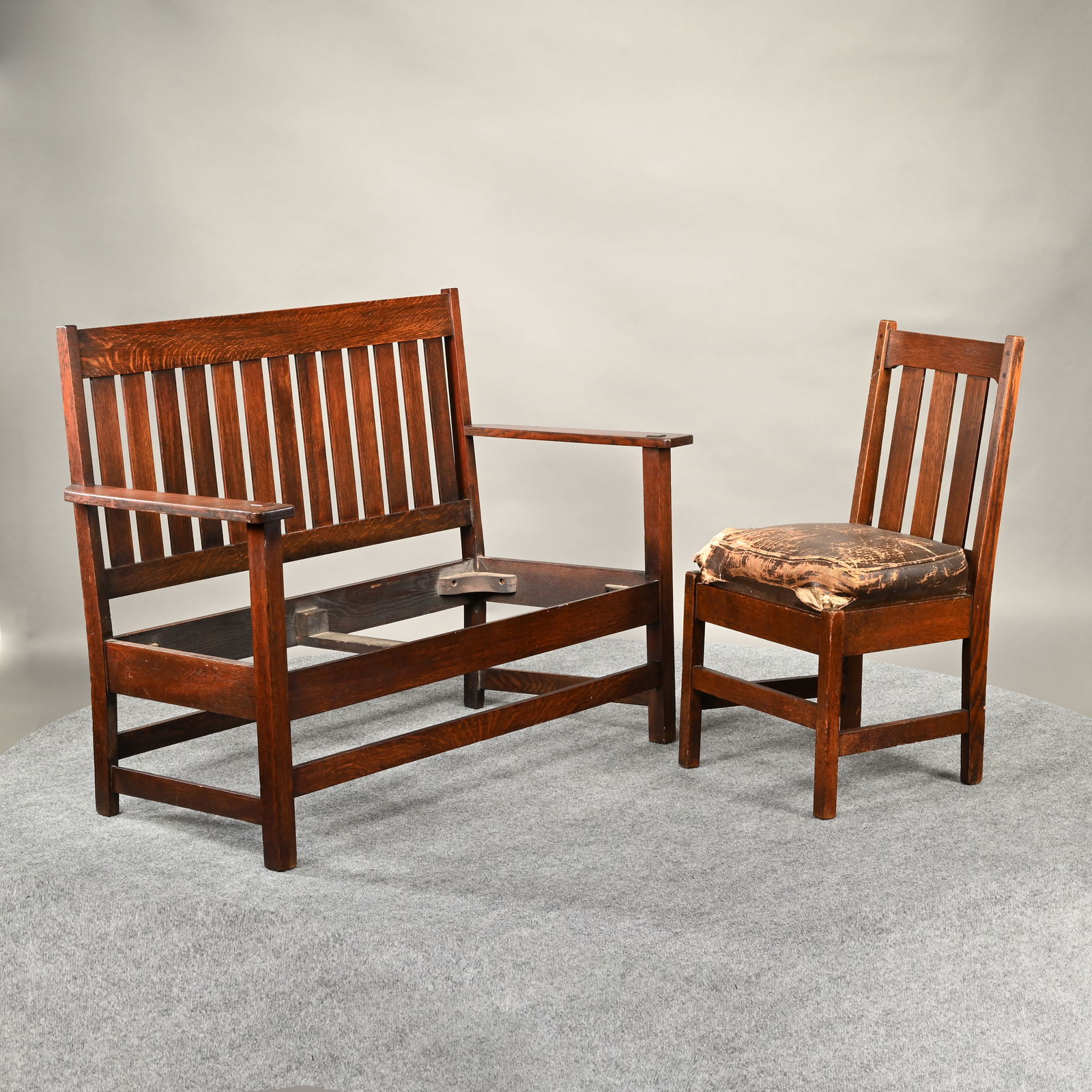 Arts & Crafts Settle,Quaker Mission Craft & Chair: American Arts & Crafts Oak Settle, Sikes Co. Quaker Mission Craft, Philadelphia, Pennsylvania; and an Arts & Crafts Oak Side Chair, Early 20th Century. The first with straight crest rail above a