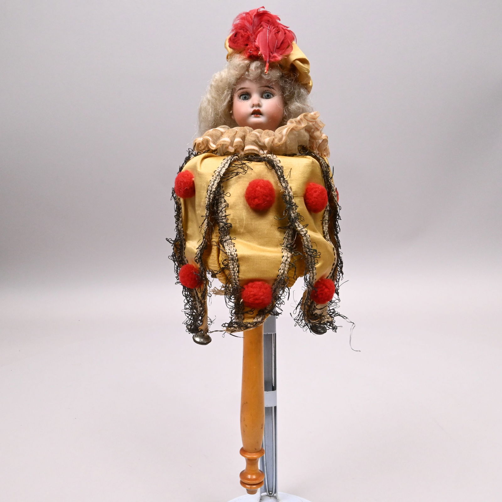 German Spinning Jester Marotte Stick Puppet: German Spinning Jester Marotte Stick Puppet, Circa 1910. Possibly Kestner or Schoenau & Hoffmeister, the doll's bisque face finely painted with fixed blue glass eyes and painted lashes, open mouth