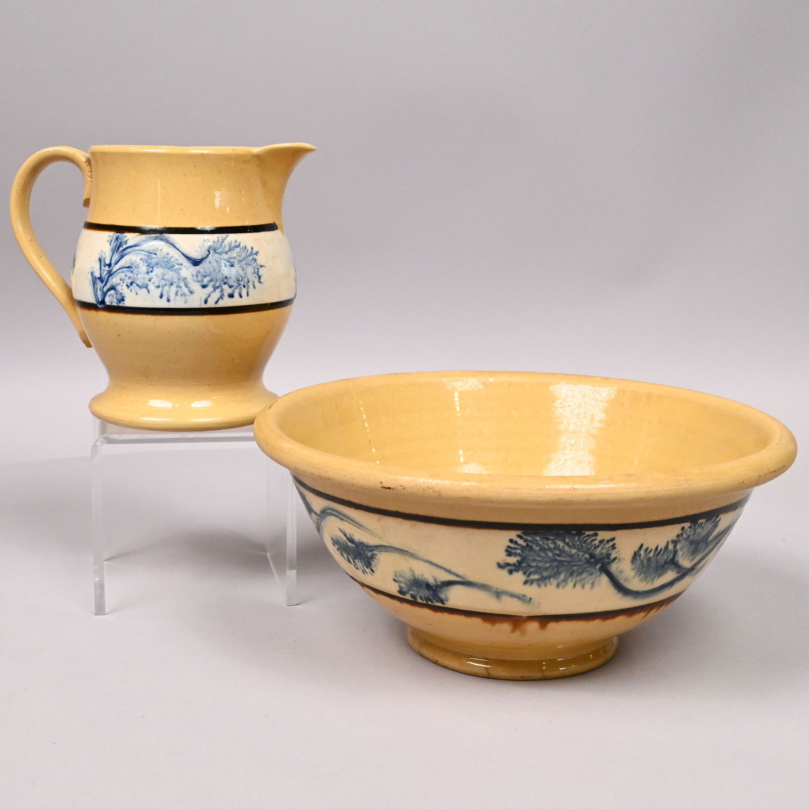 Yellowware Dendritic Mochaware Jug & Bowl: Yellowware Dendritic Slip-Banded Mochaware Jug and a Mixing Bowl, British or American, 1840-1870. Each slip-banded in dark brown with a row of blue dendritic leaves and stems on a white slip